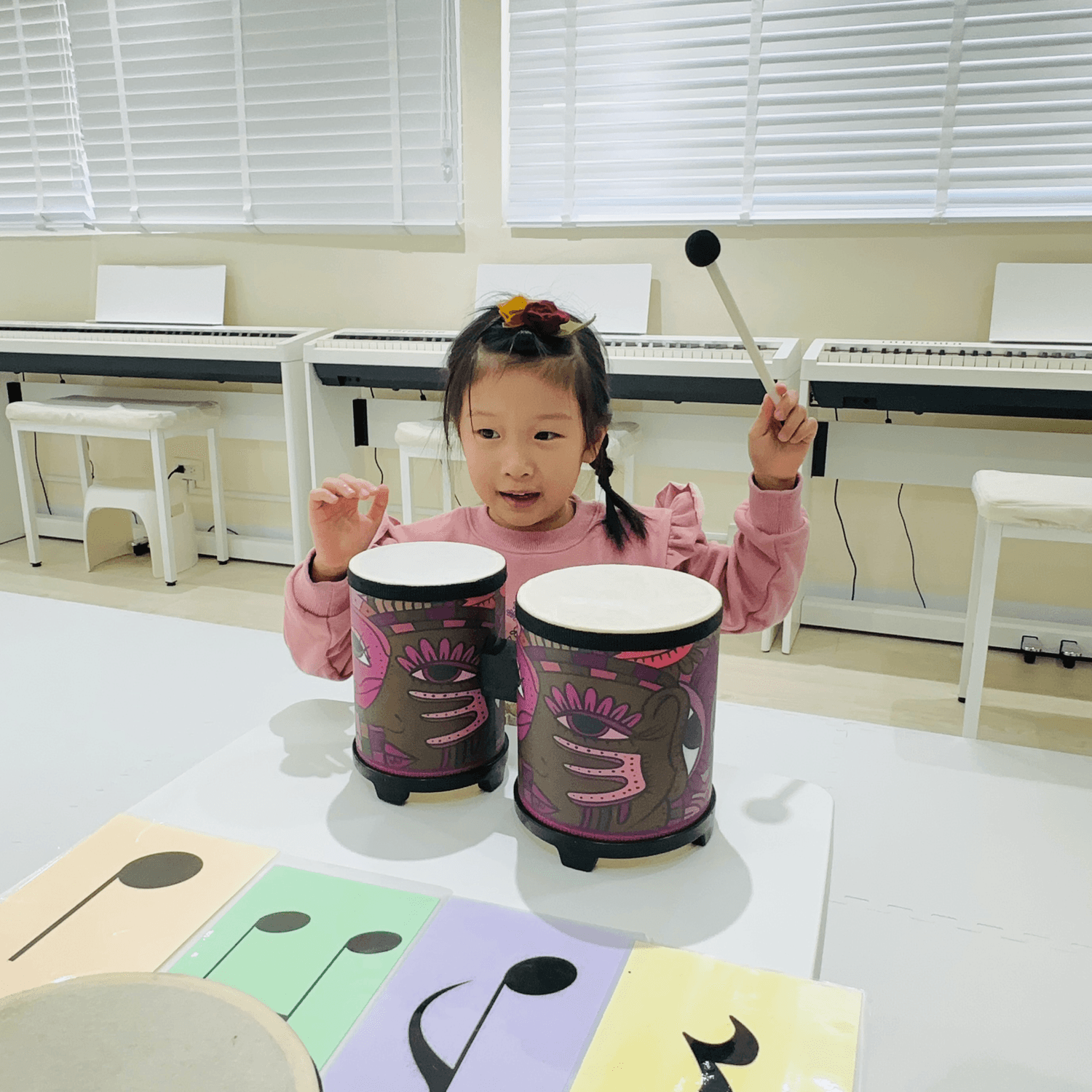 Bright, spacious gallery interior with vaulted white arches, tall windows, and reflective wooden floors