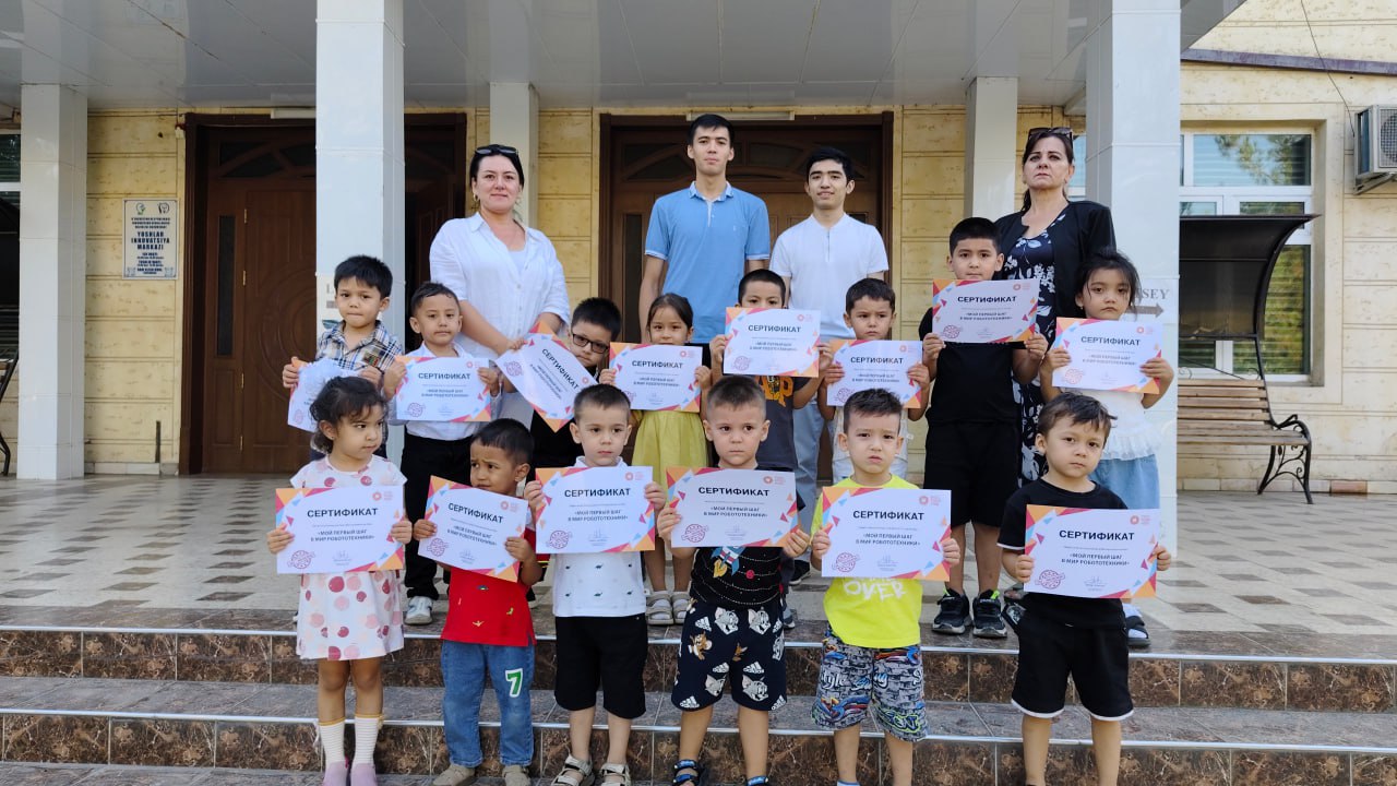 A man stading with Surfboard