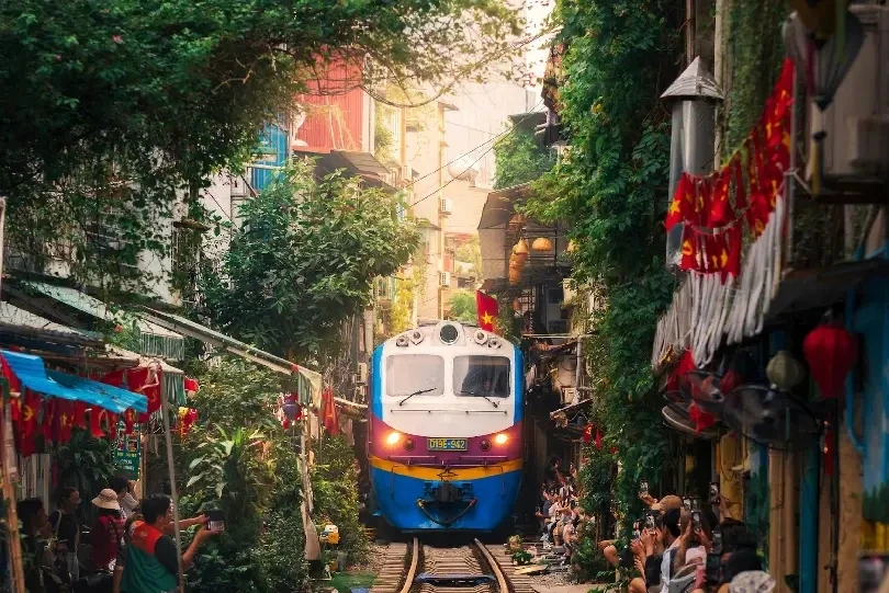 Train passing narrow alley
