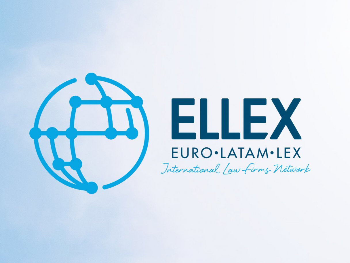 Rustic cabin in a golden field at sunset