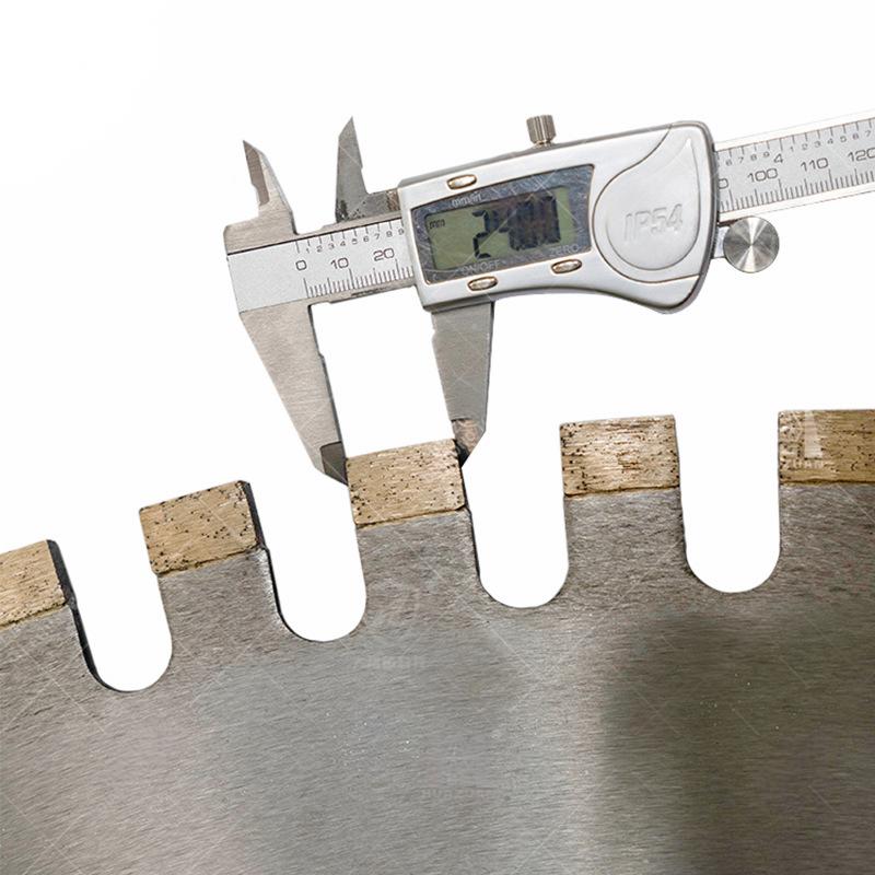 Measuring the thickness of the segmented teeth on a Horizontal Diamond Saw Blade using a caliper.