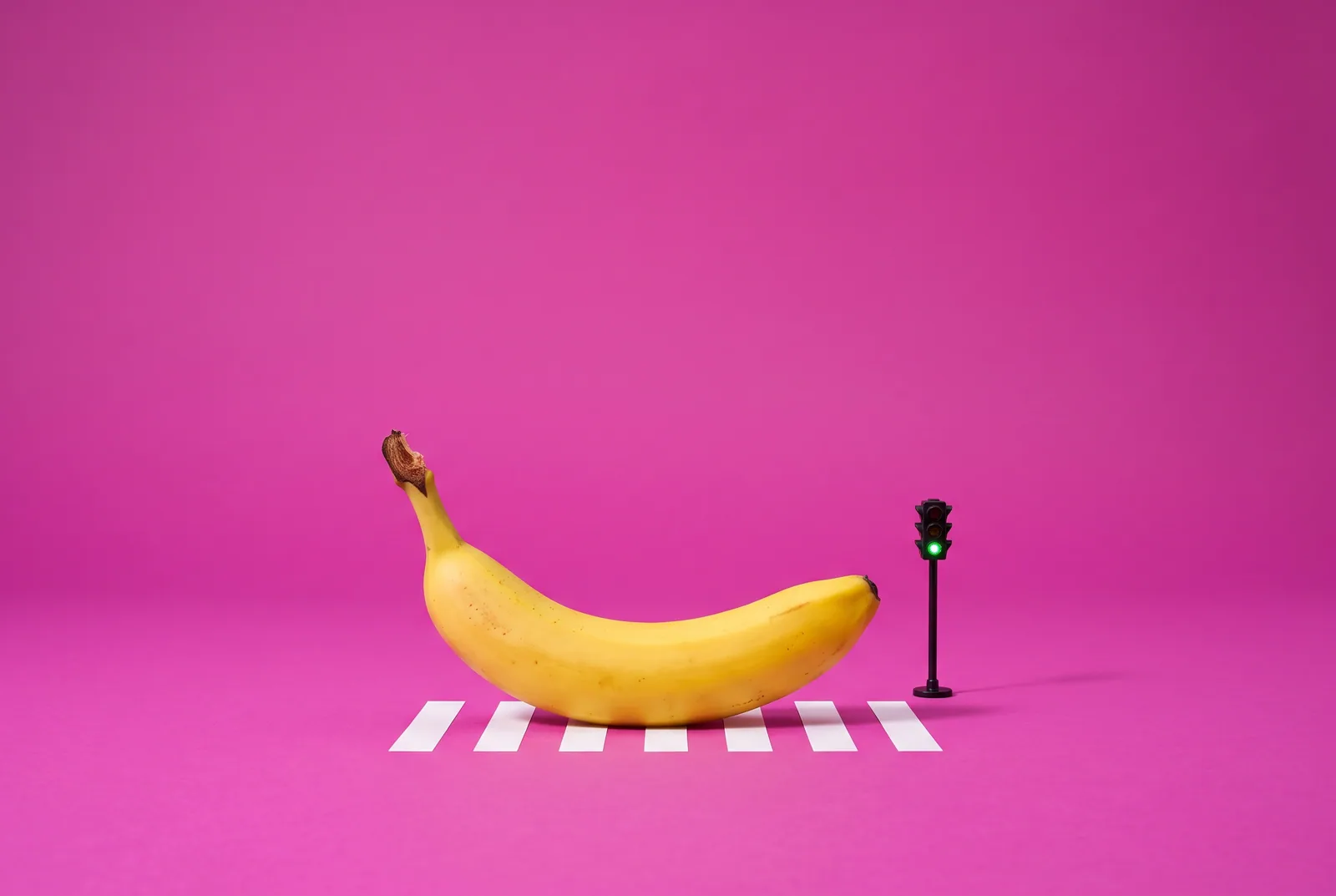 A banana crossing a tiny zebra crossing at a green light, switching to a Remojo alternative without losing momentum