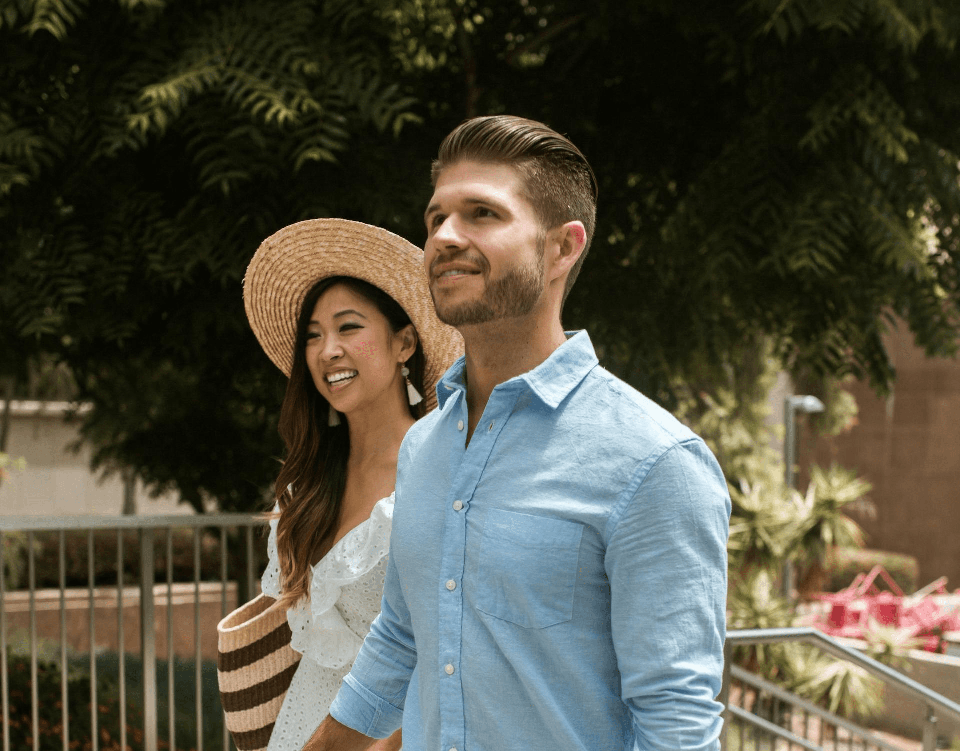 Happy couple walking outdoors together, symbolizing trust and strong relationship