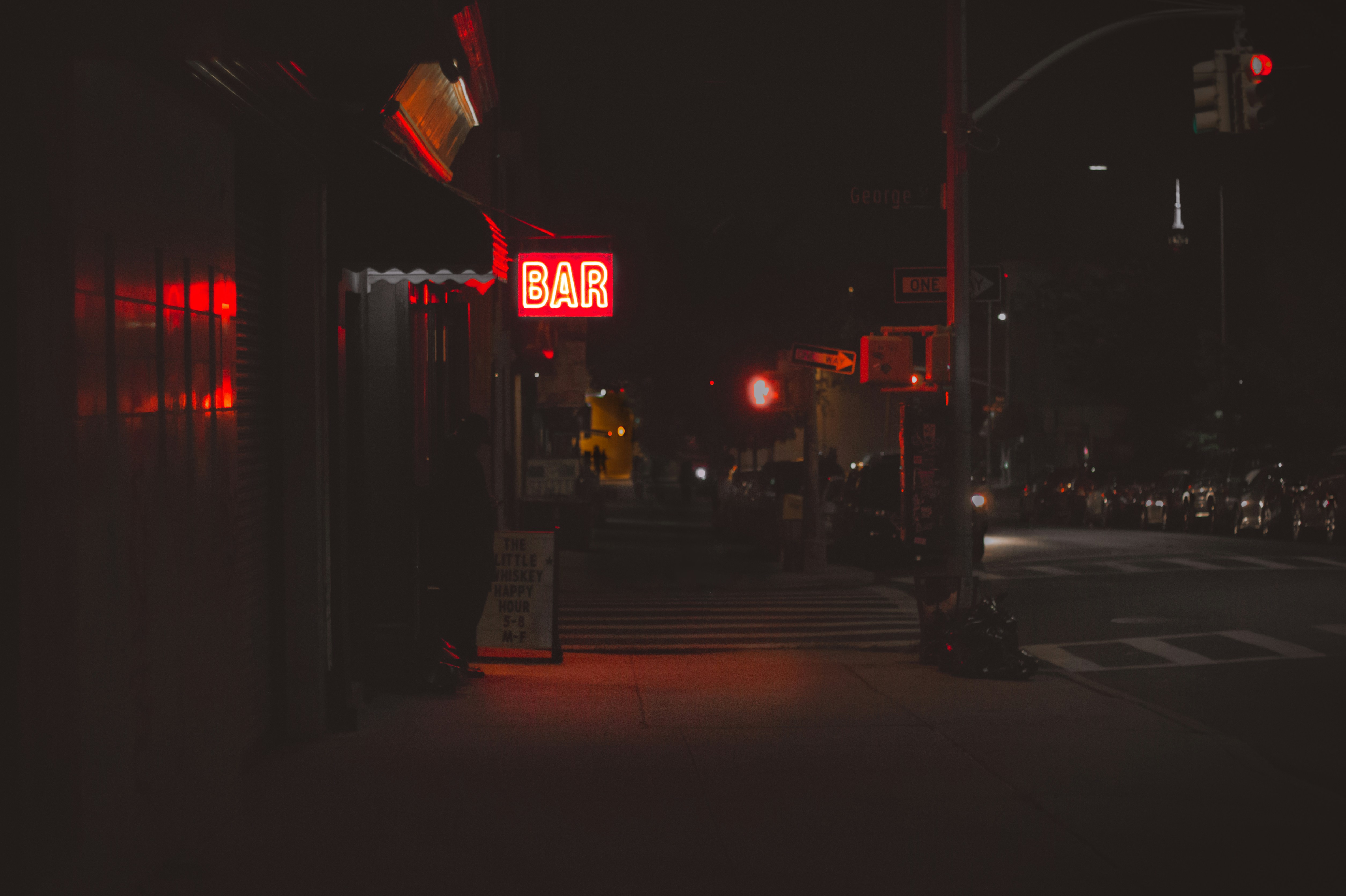 lighted bar signage during nighttime