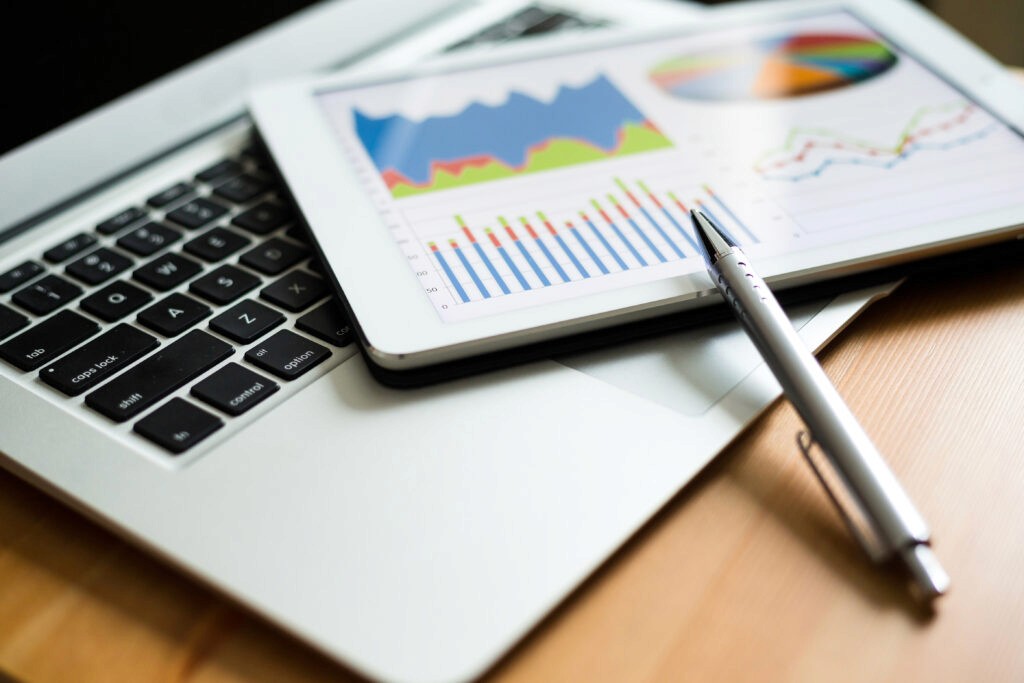 Image of a laptop and pen.