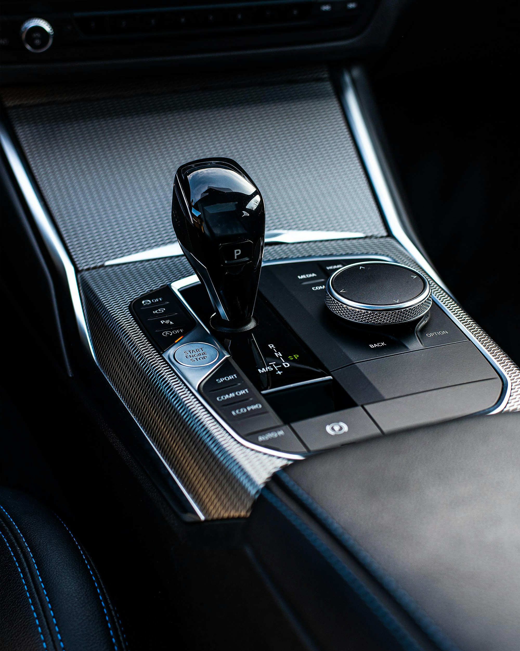 BMW automatic gear shift selector and iDrive control dial.