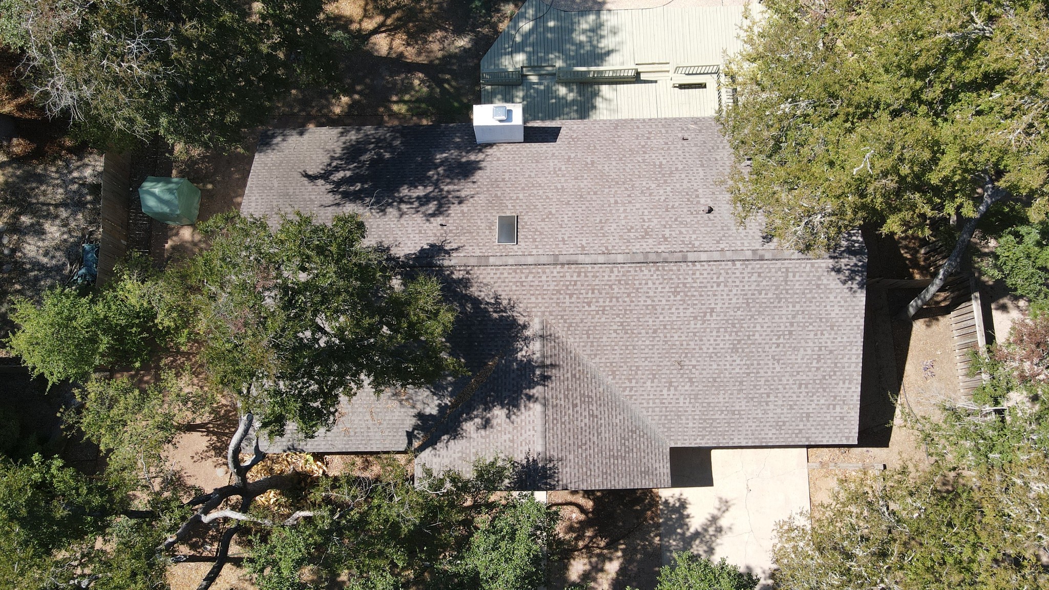 Architectural shingles roof featuring skylights, providing both durability and natural light for a bright, welcoming interior.