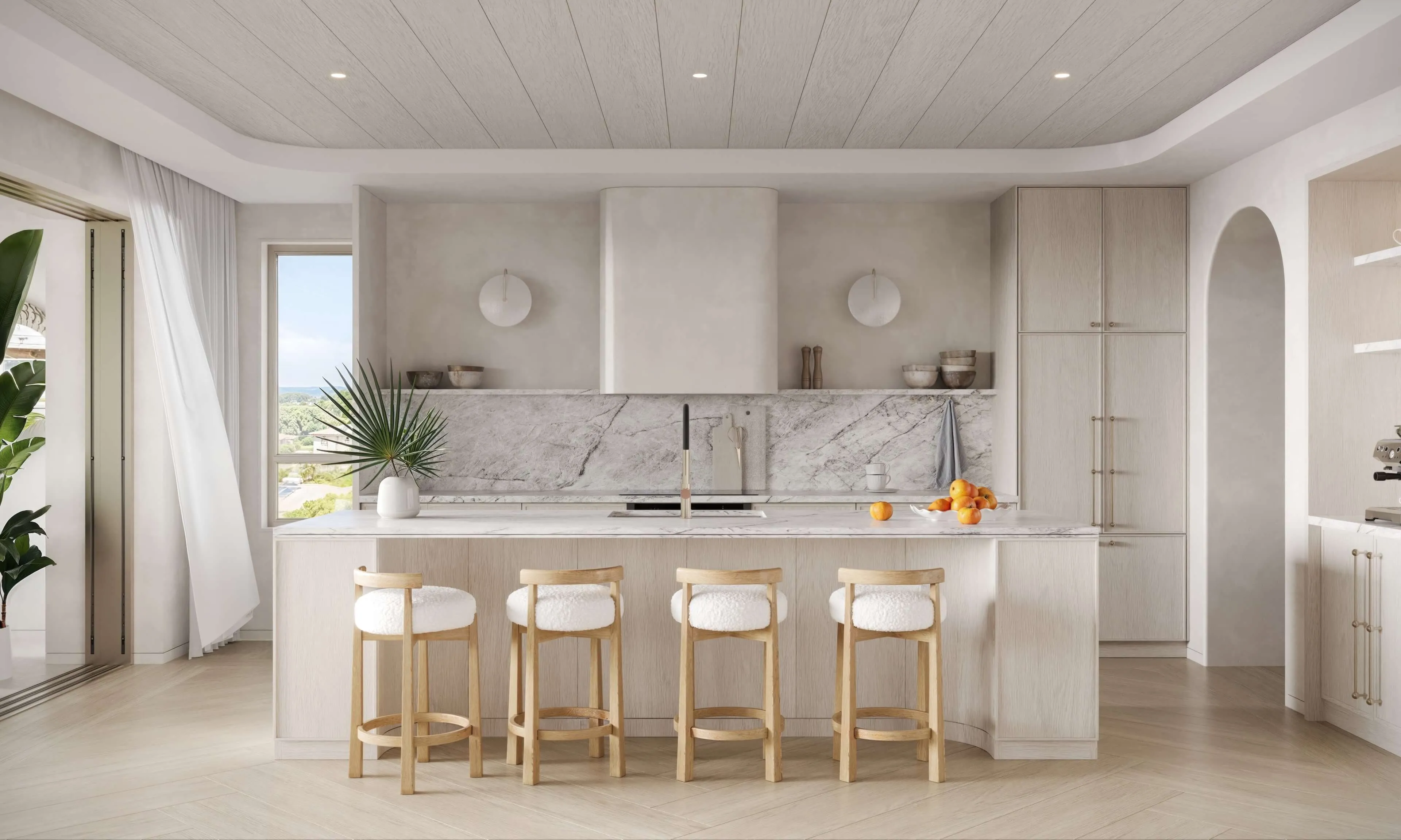 Modern kitchen with white cabinets, a large island, and wooden bar stools, featuring natural light through windows.