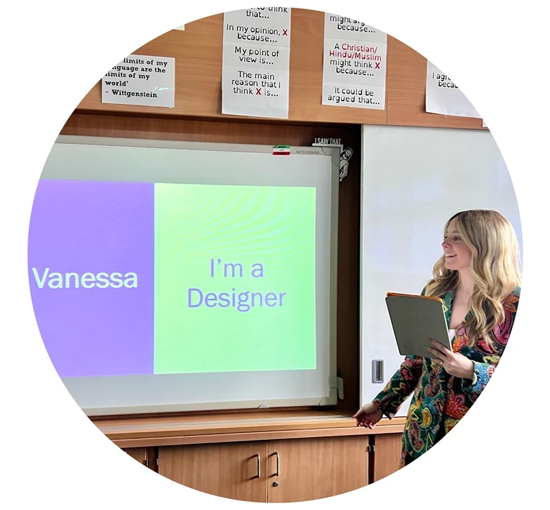 photo of someone presenting in front of a screen that says'vanessa' and 'I'm a designer'