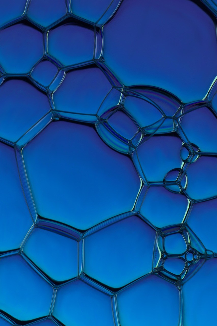 stainless steel robot toy in close up photography