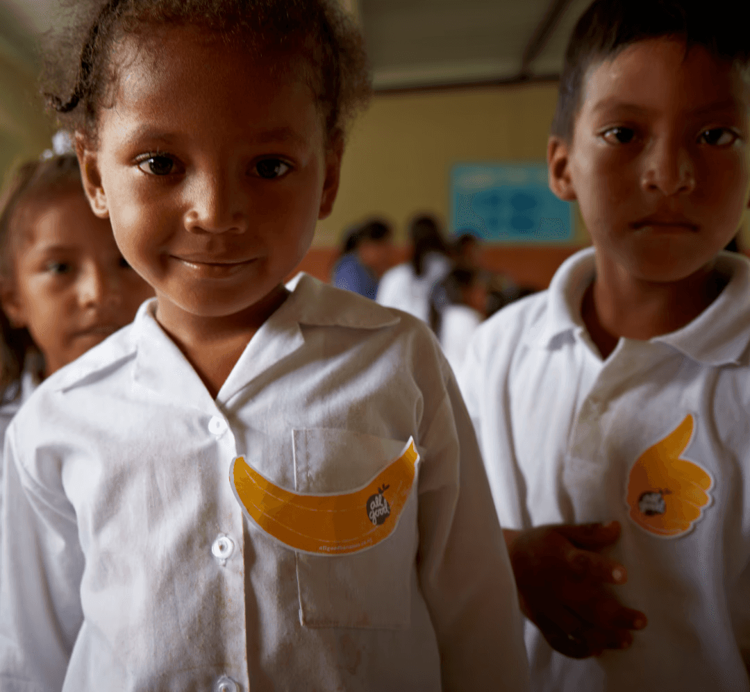 three children at the beach during golden hour
