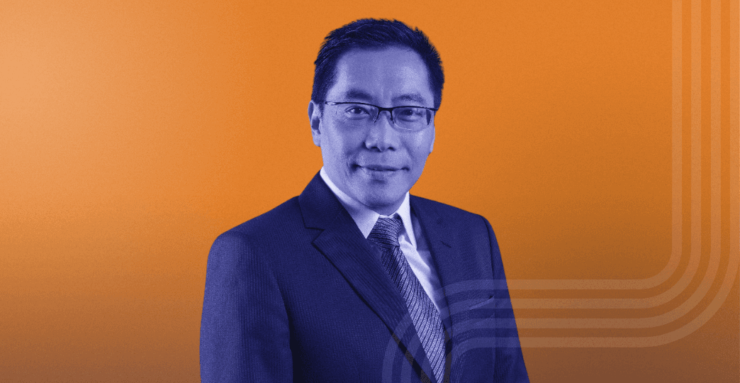 man in suit jacket sitting down