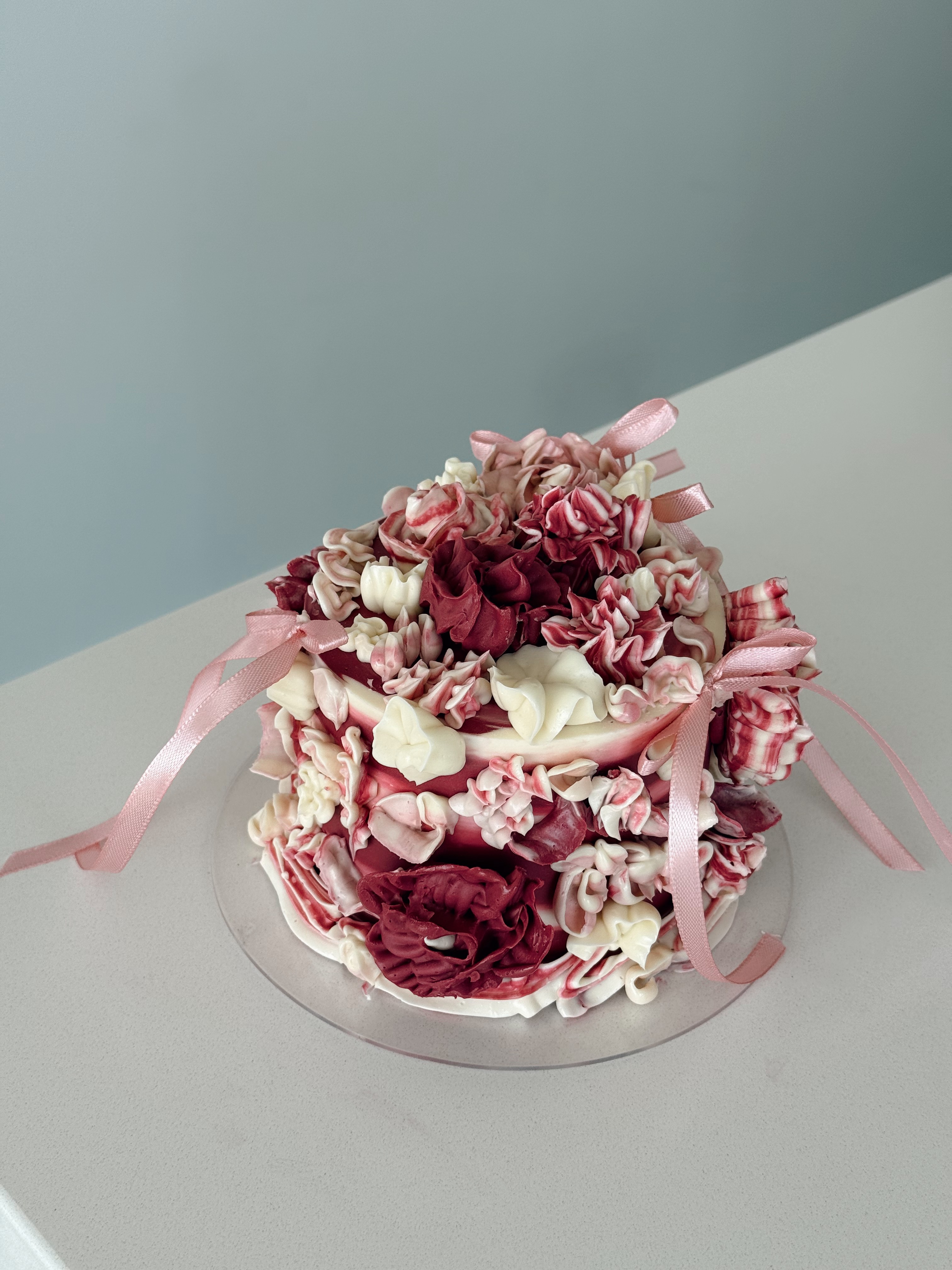 Star-shaped white cake with vintage ruffle piping and pearl details