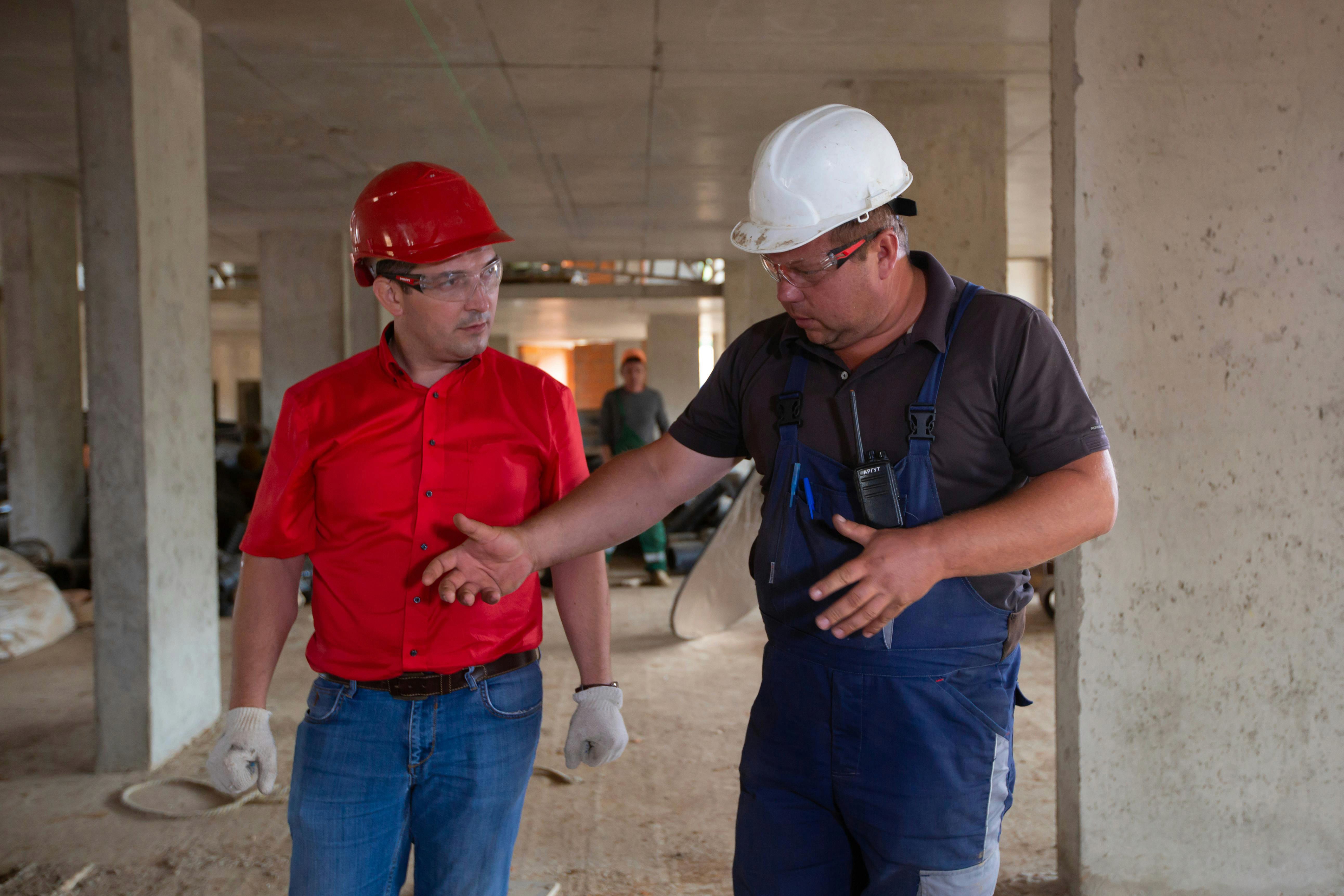 Two construction professionals discussing work on site