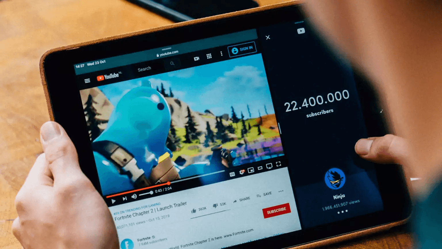Person watching Youtube video - How to Create a Faceless YouTube Channel