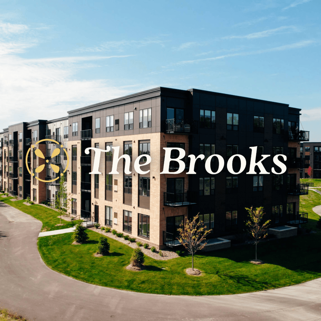 Exterior view of The Brooks Apartments in Plymouth, Minnesota captured during golden hour.