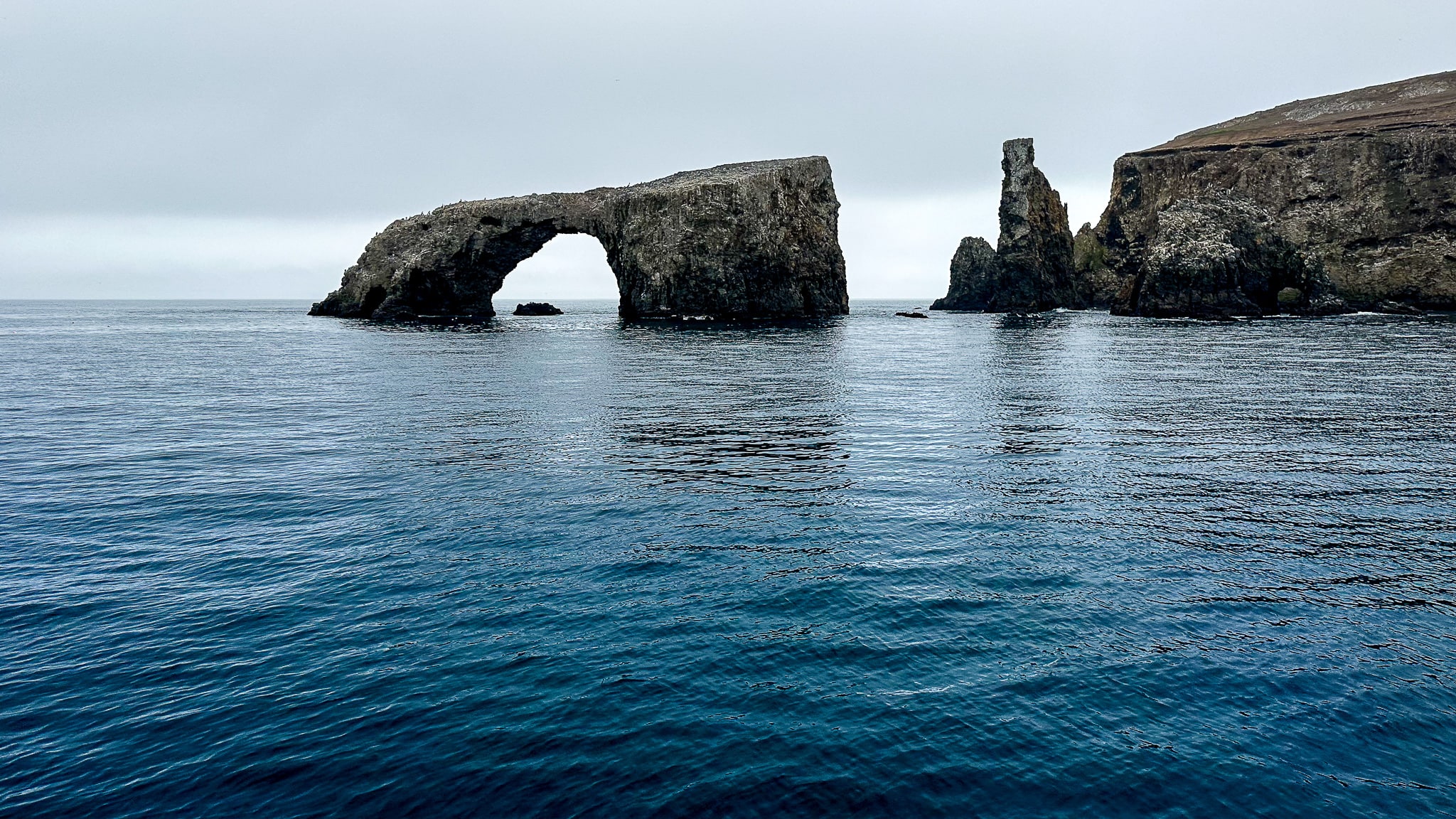 arch rock over a deep blue ocean