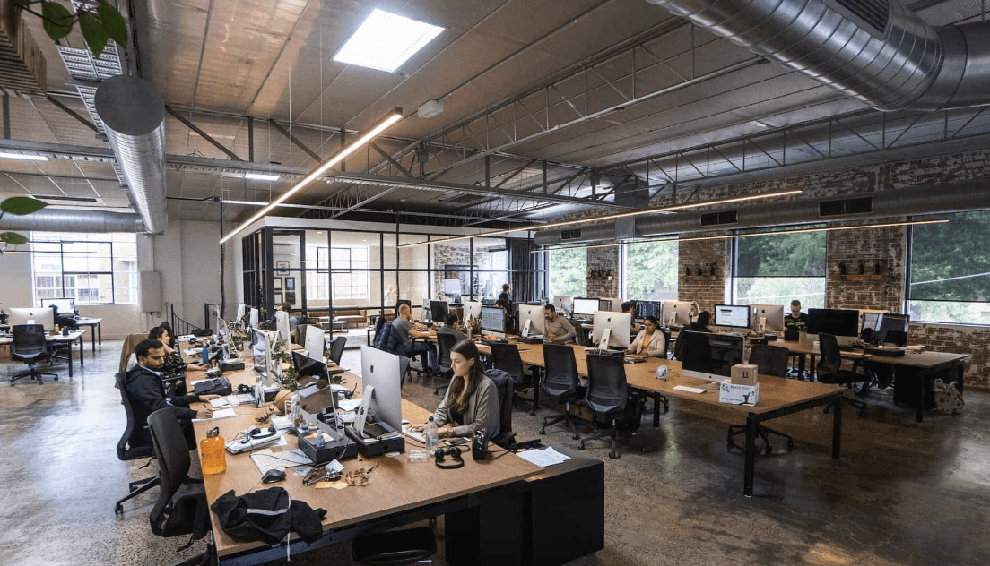 People celebrating, red stickers floating in the air