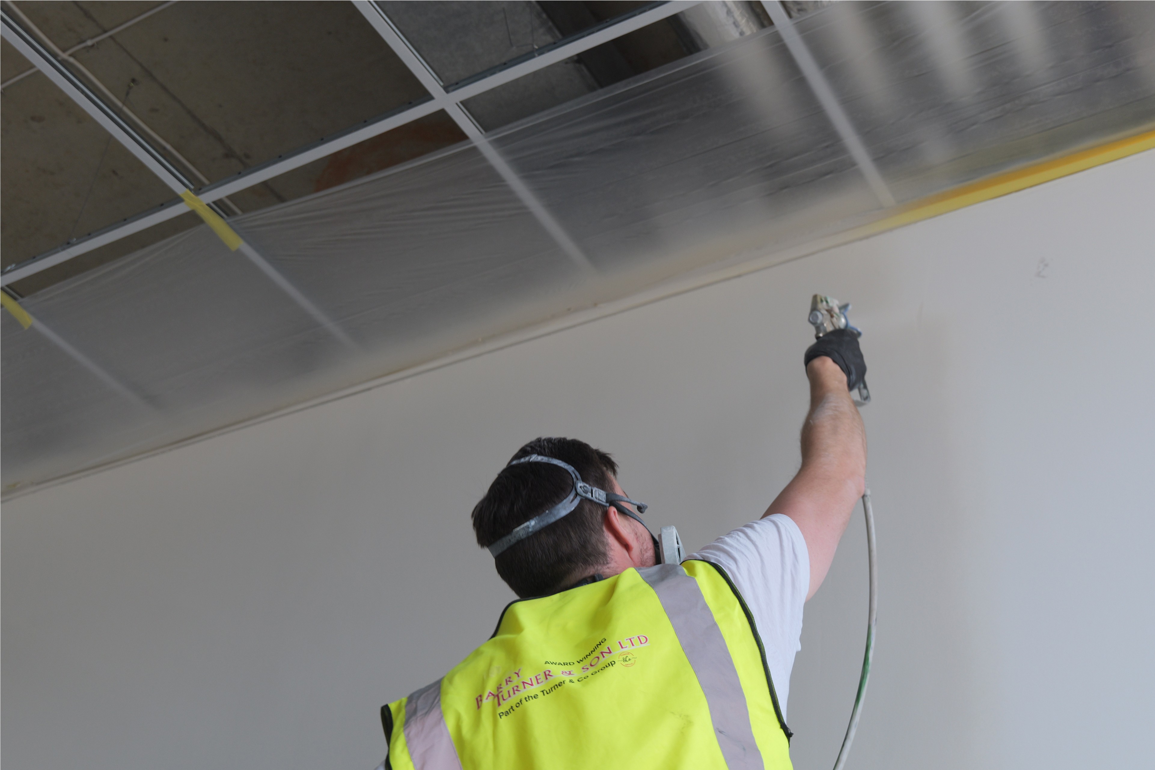 Barry Turner and Son team payinting the walls with a final finish