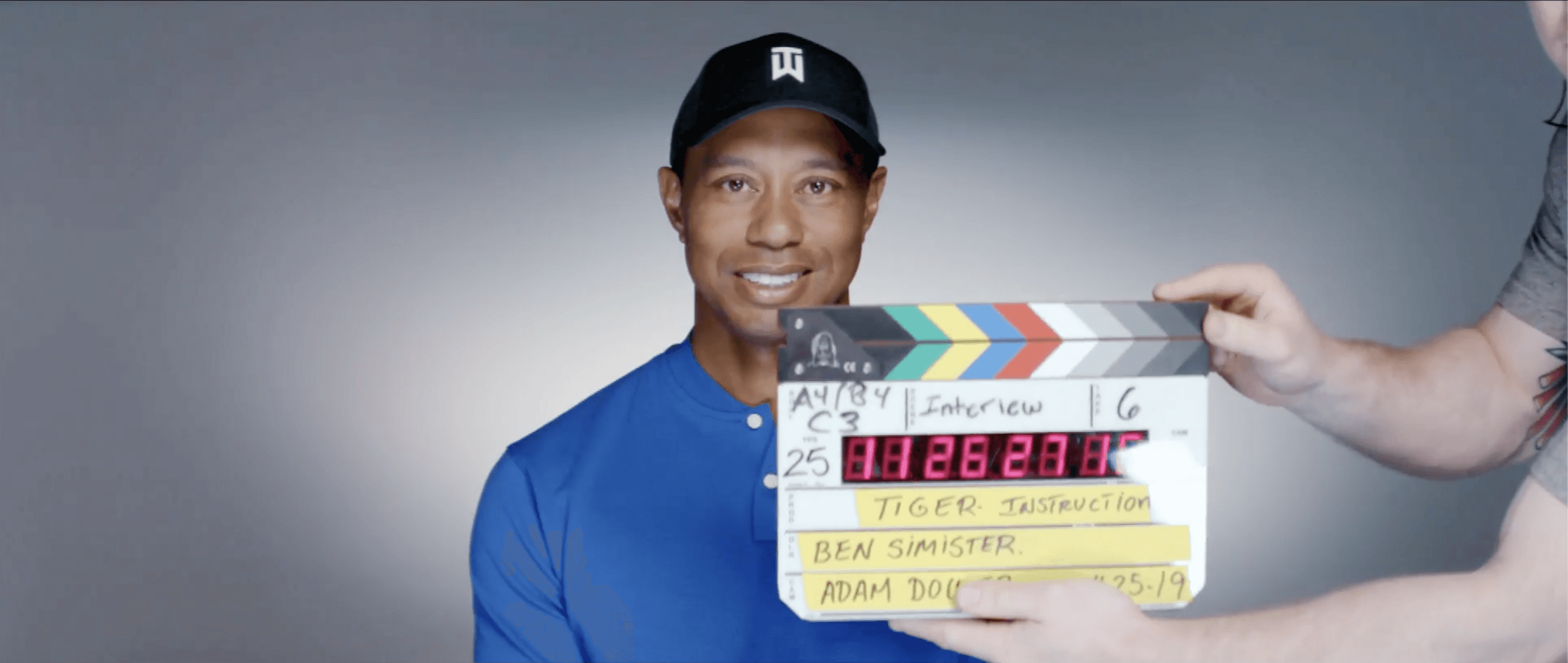 man in black shirt and white shorts playing golf during daytime