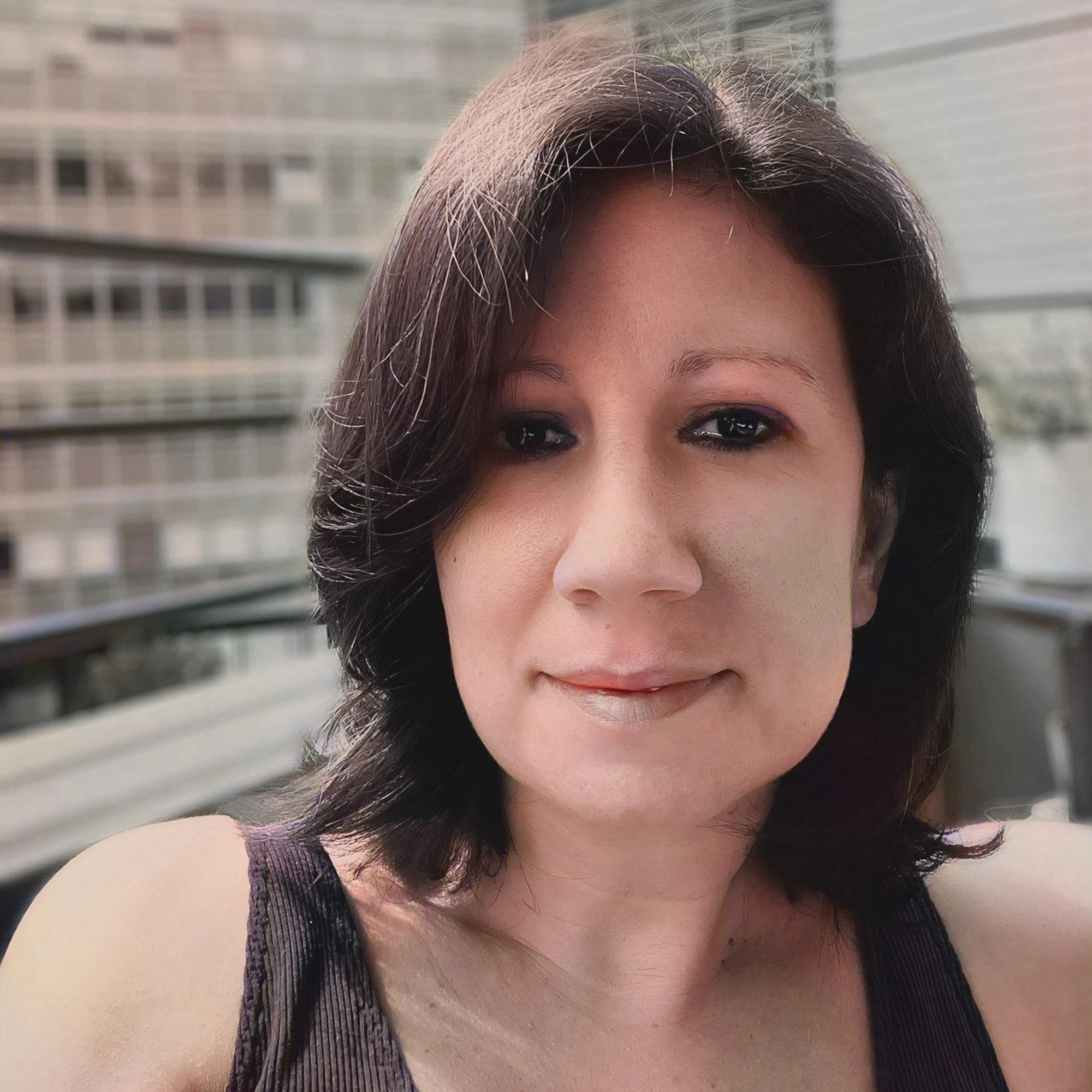 man in green crew neck shirt and black hat