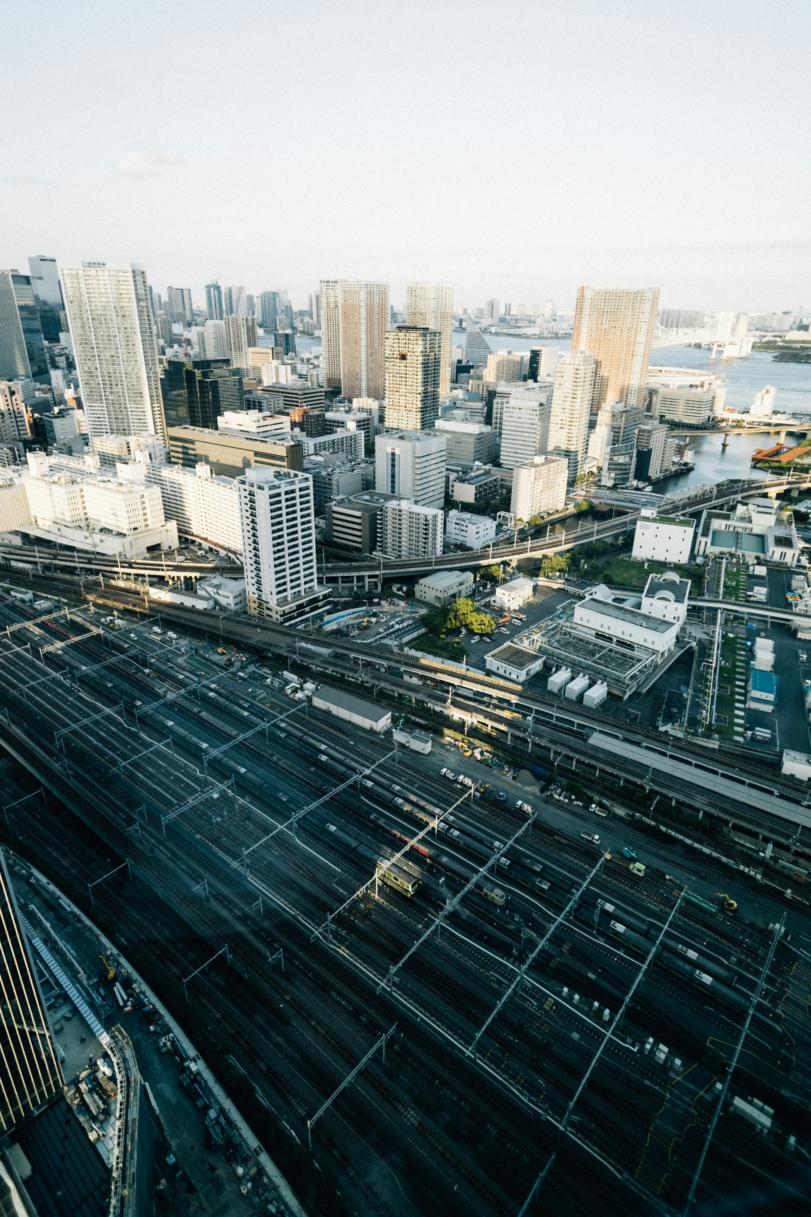 Aerial view of a bustling city with train tracks.