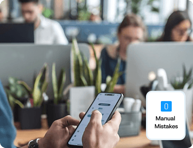 Team using laptops and smartphones with a “Manual Mistakes” alert icon, representing automated project workflows replacing spreadsheets.