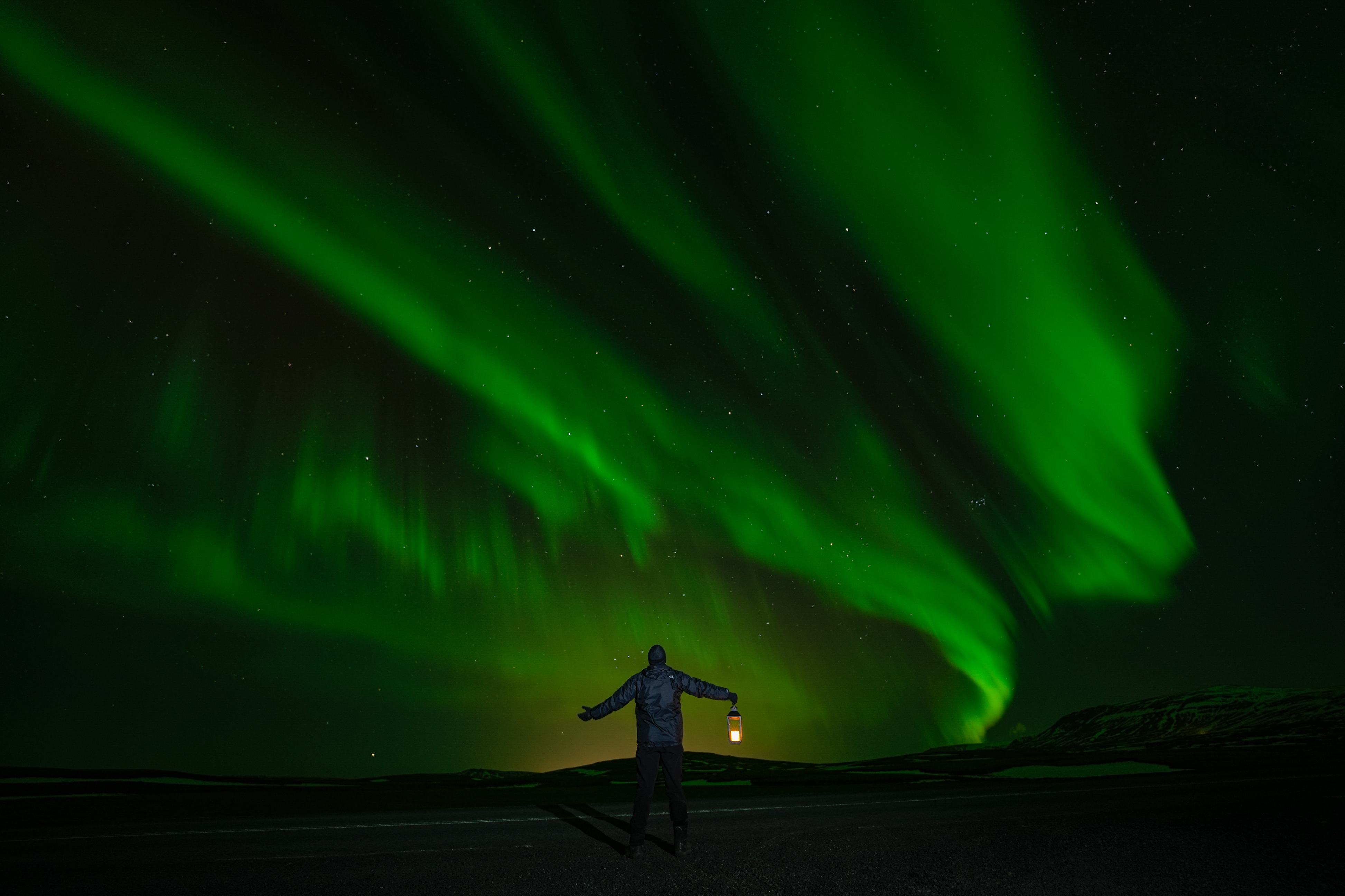 Northern Lights tour photography from Aurora Experts in Iceland, featuring guests beneath the aurora, winter landscapes, and vivid skies over remote Icelandic locations.