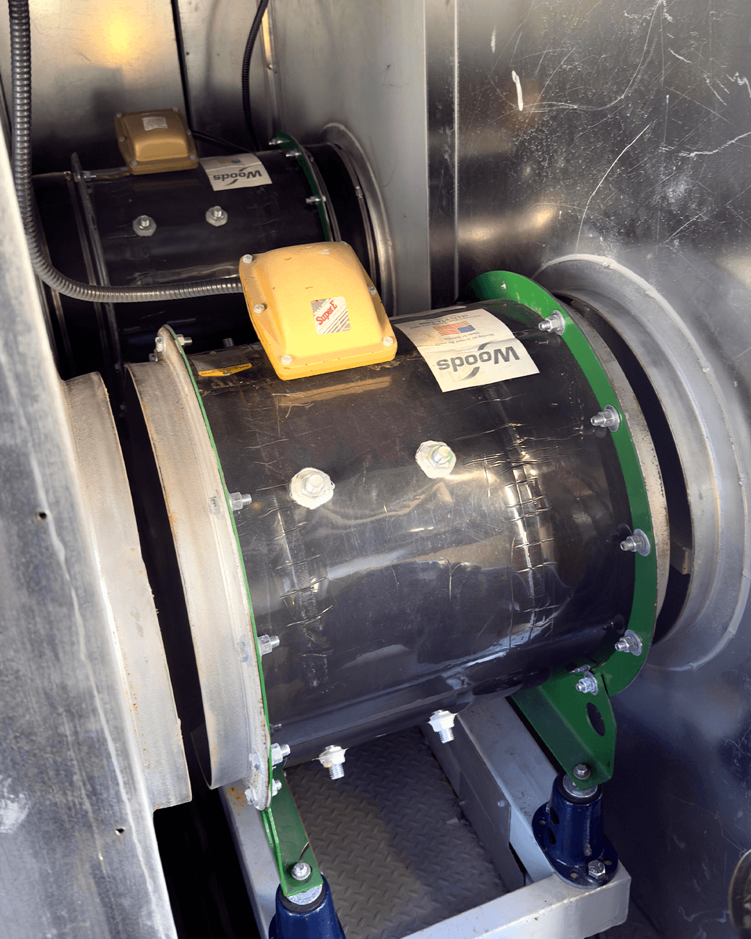 Legacy obsolete fan inside a hospital air handling unit prior to retrofit.