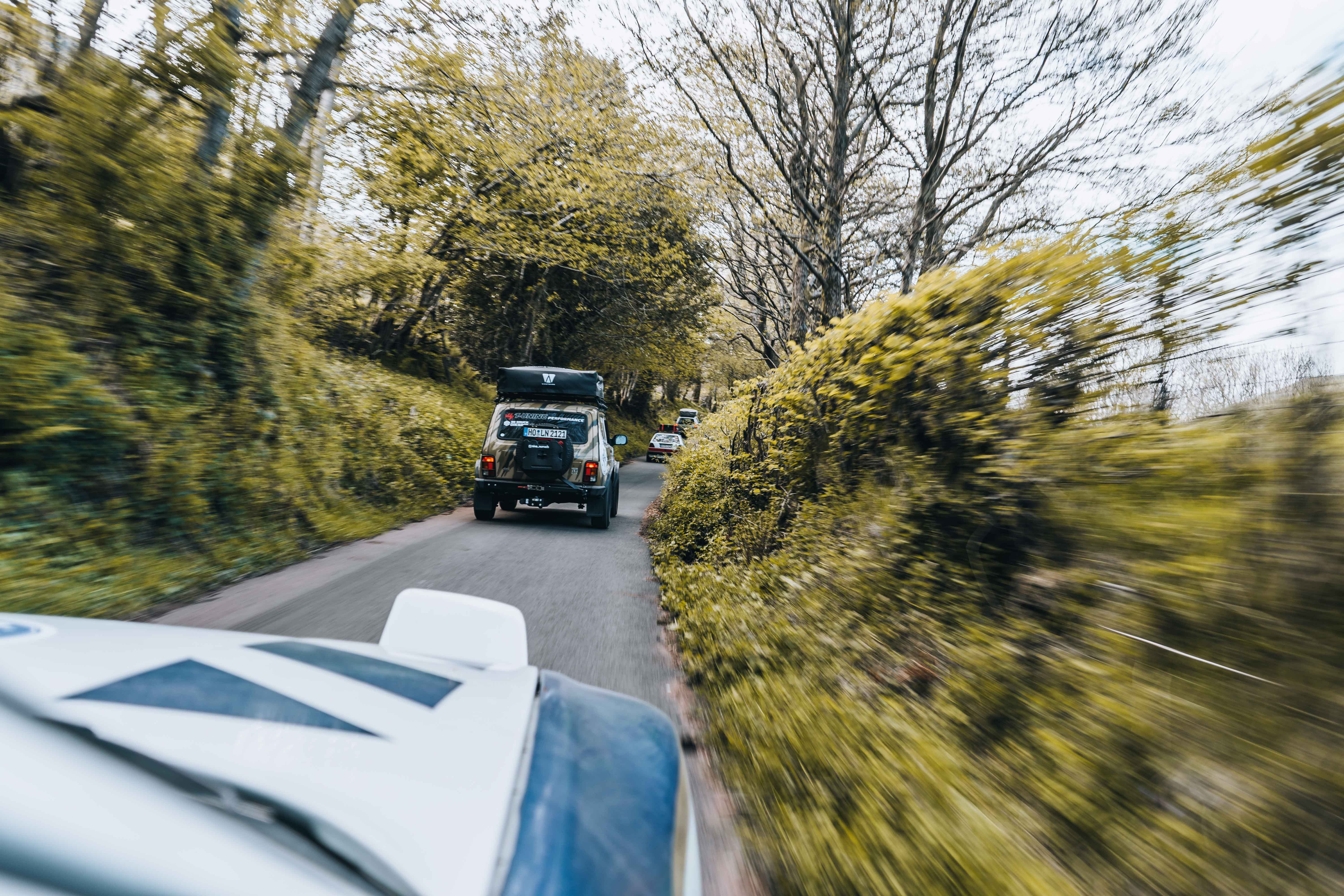 Wide desert landscape with cliffs and open sky.