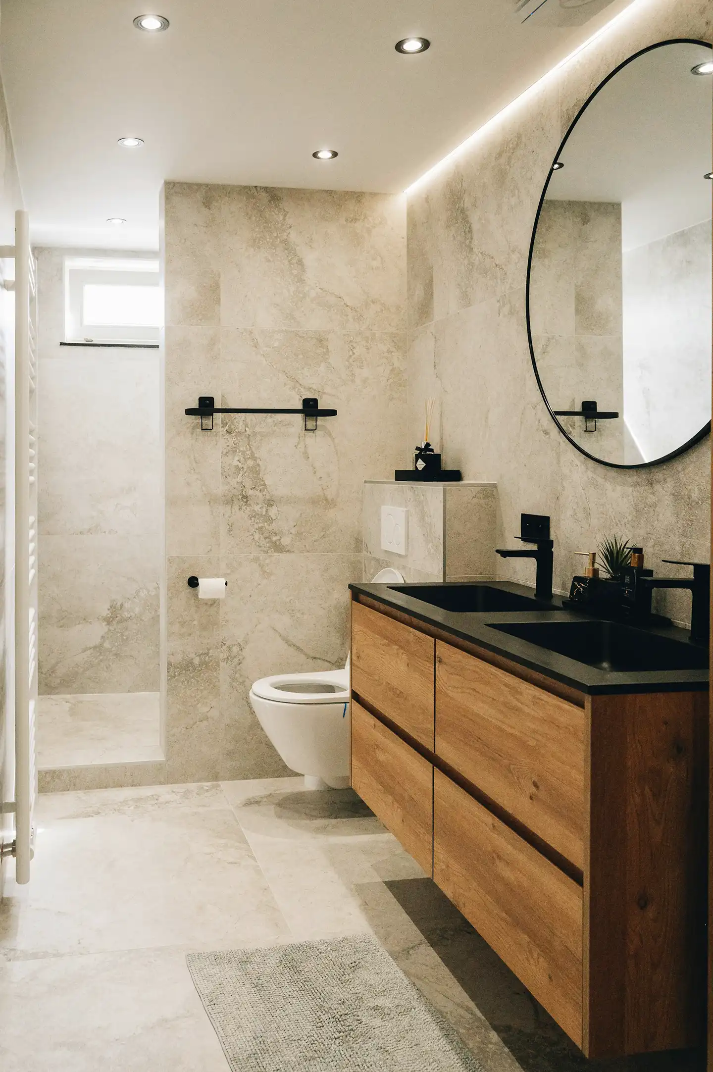 Well-lit bathroom with mirror cabinet and contemporary fittings