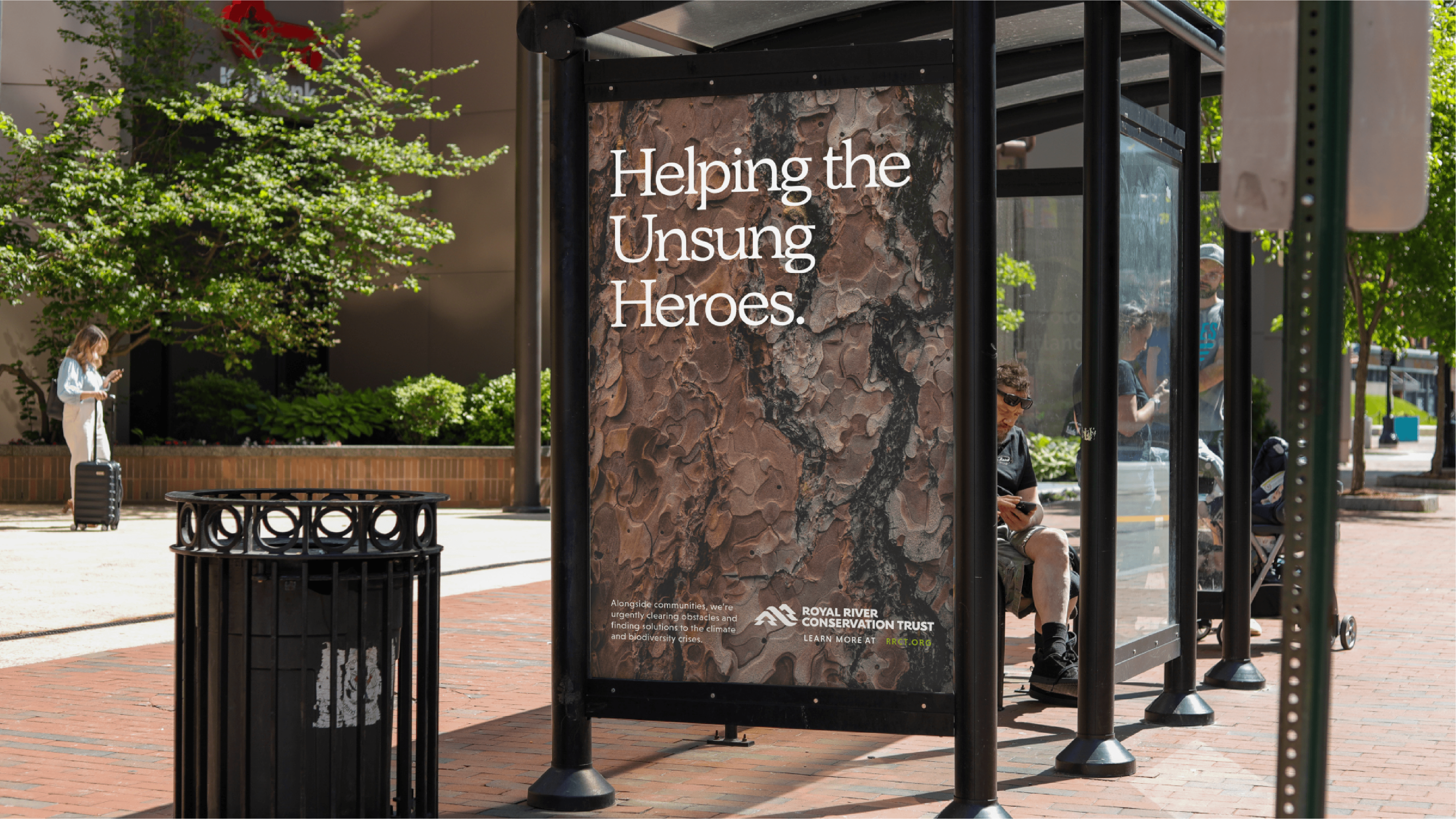 Royal River Conservation Trust bus shelter advertisement promoting environmental stewardship in urban setting