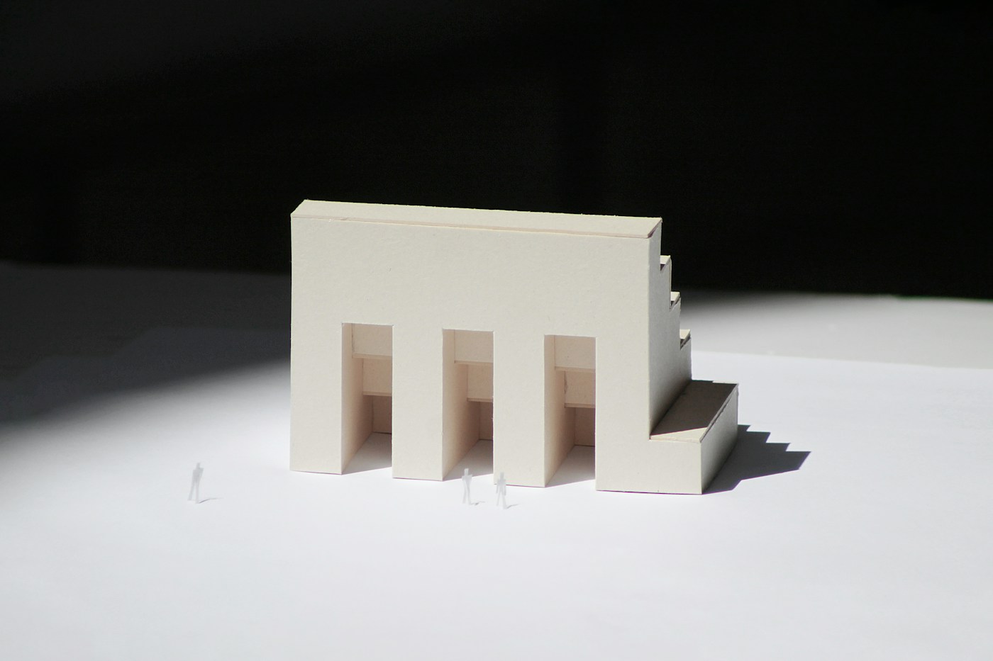 A white concept model of a low house