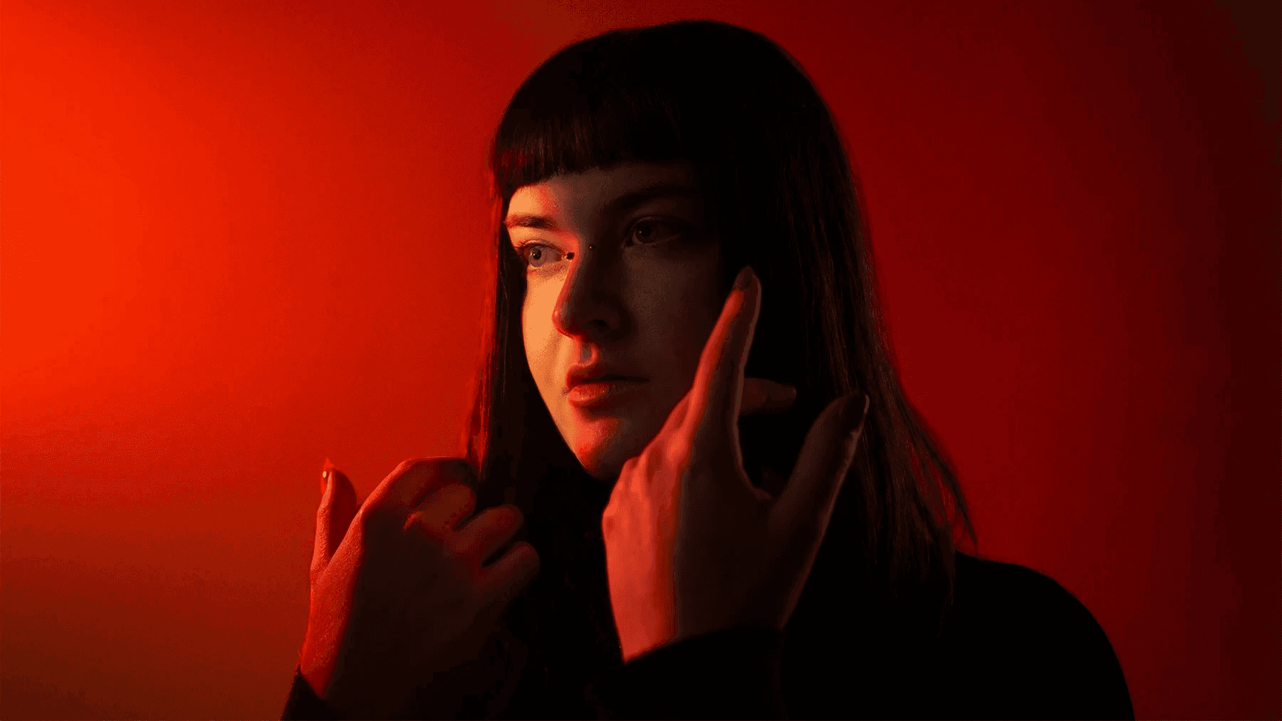 Women in front of an orange background