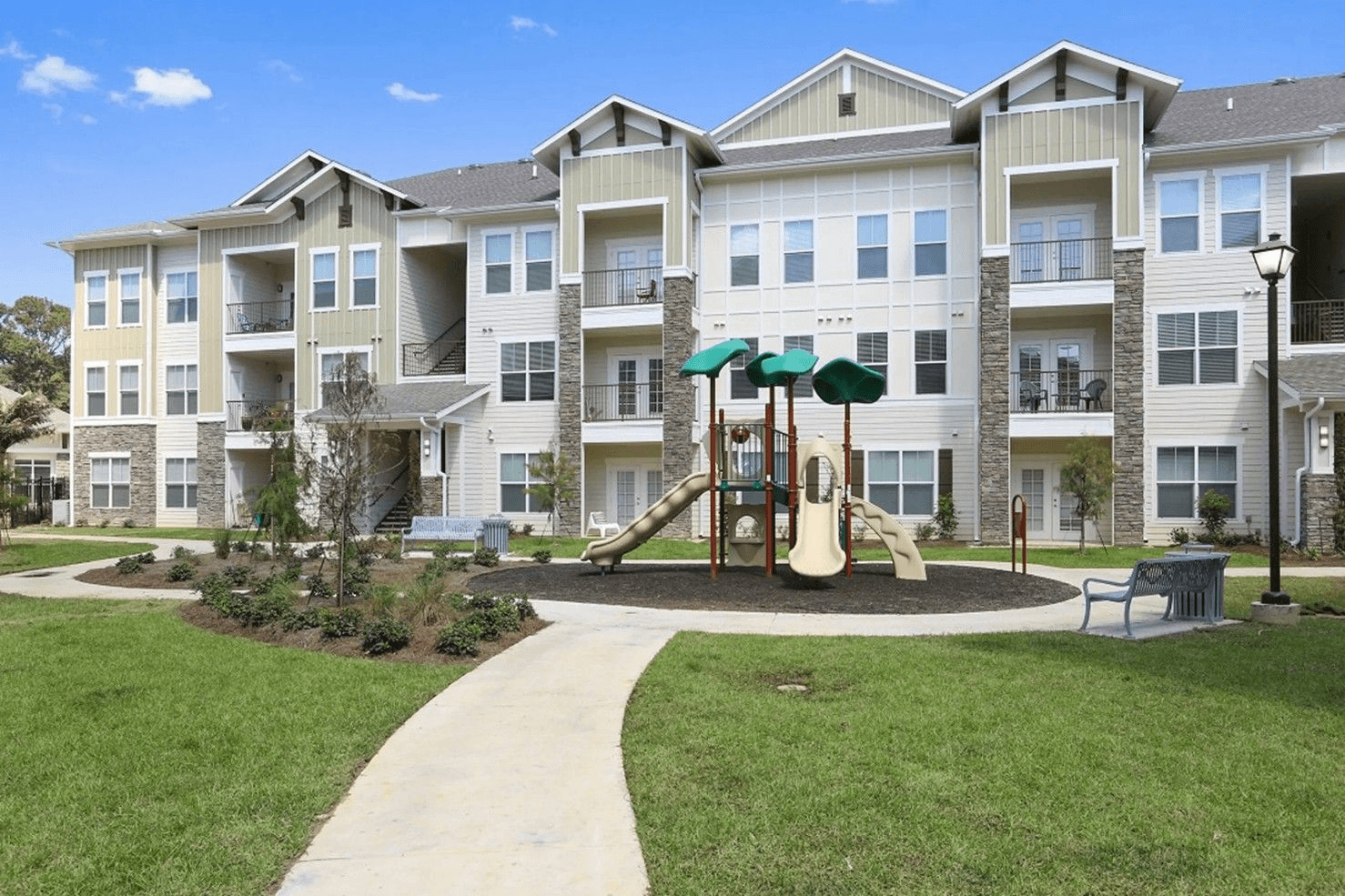 Playground and landscaped common area at Creekside Crossing.