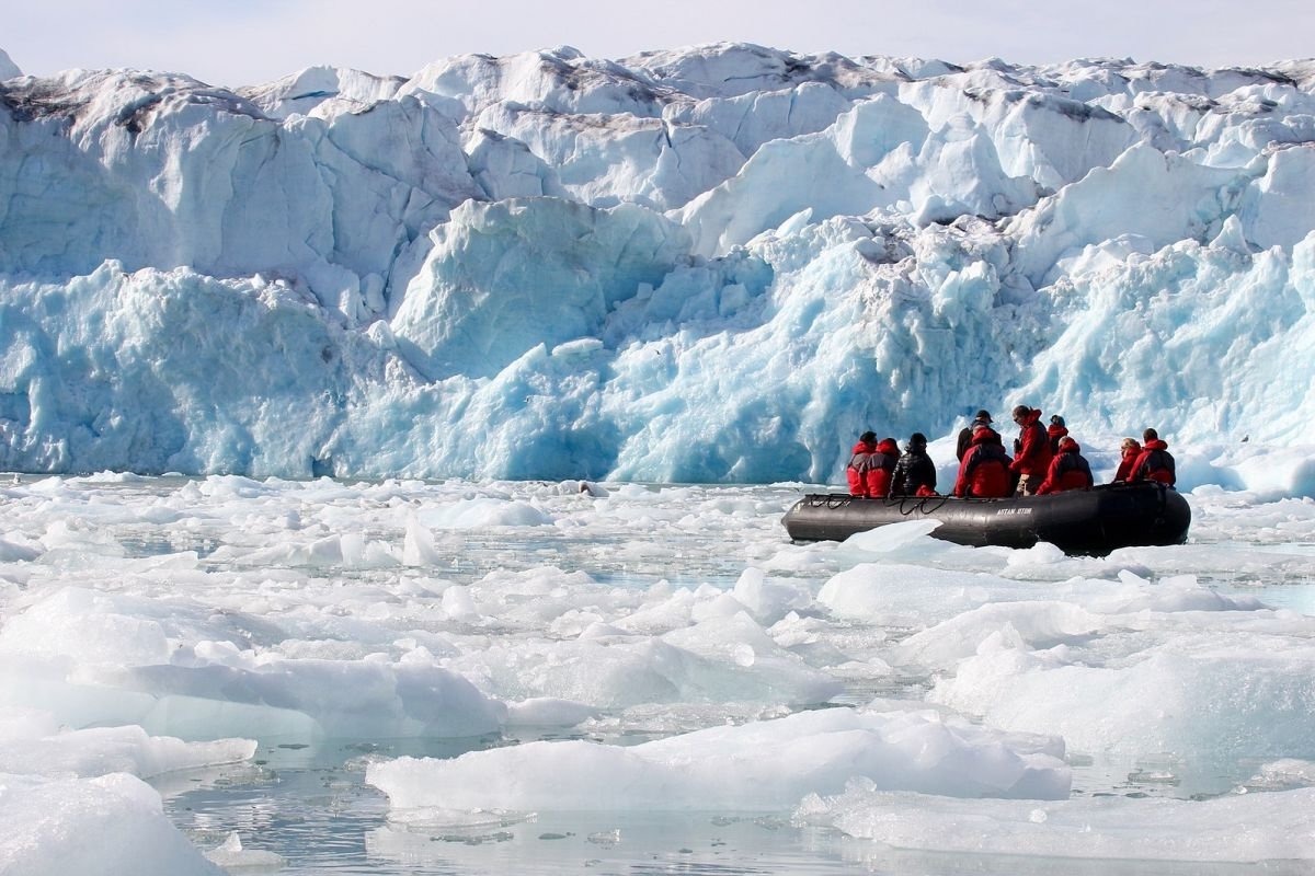 brown and white temple surrounded by green trees during daytime
