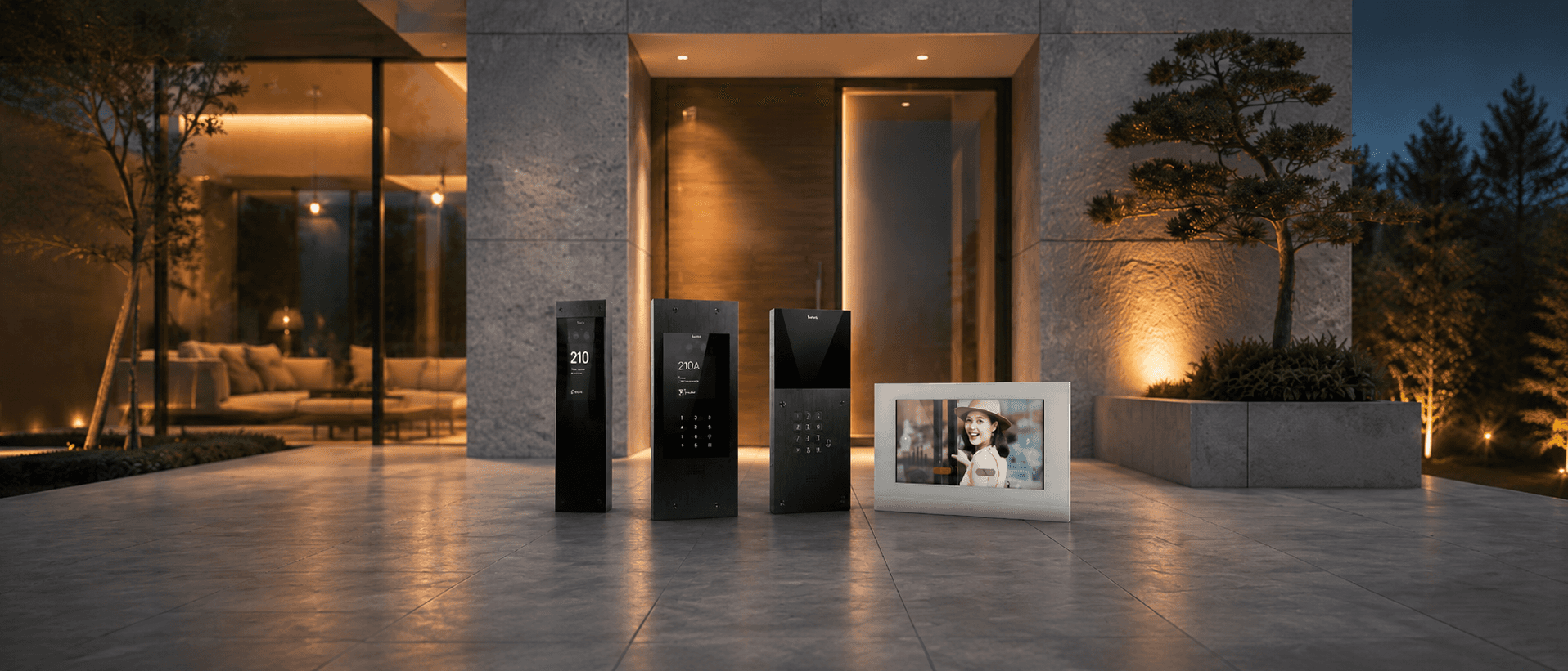 Modern intercoms and digital photo frame outside luxury home.
