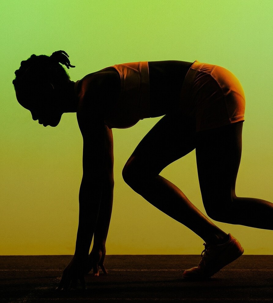 Silhouette of a person in a sprint start position