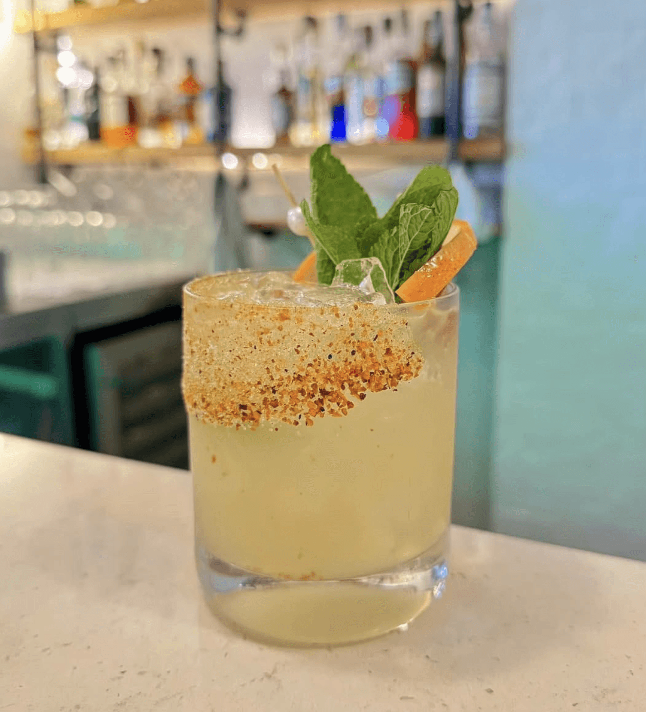 Restaurant exterior with black facade and welcoming atmosphere.