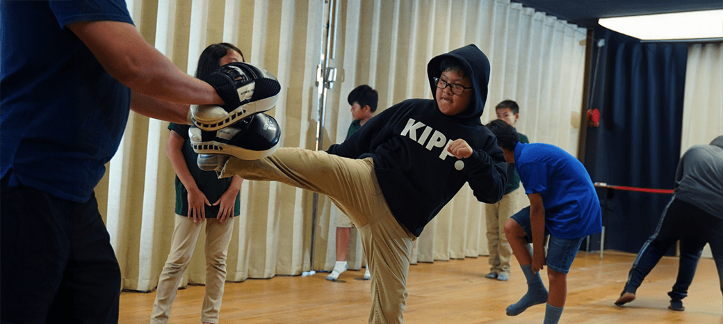 Students practicing discipline and basic striking techniques in a HOKALI karate after-school program