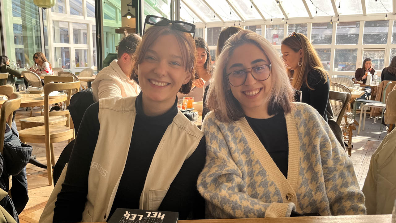 group photo of two people at a restaurant