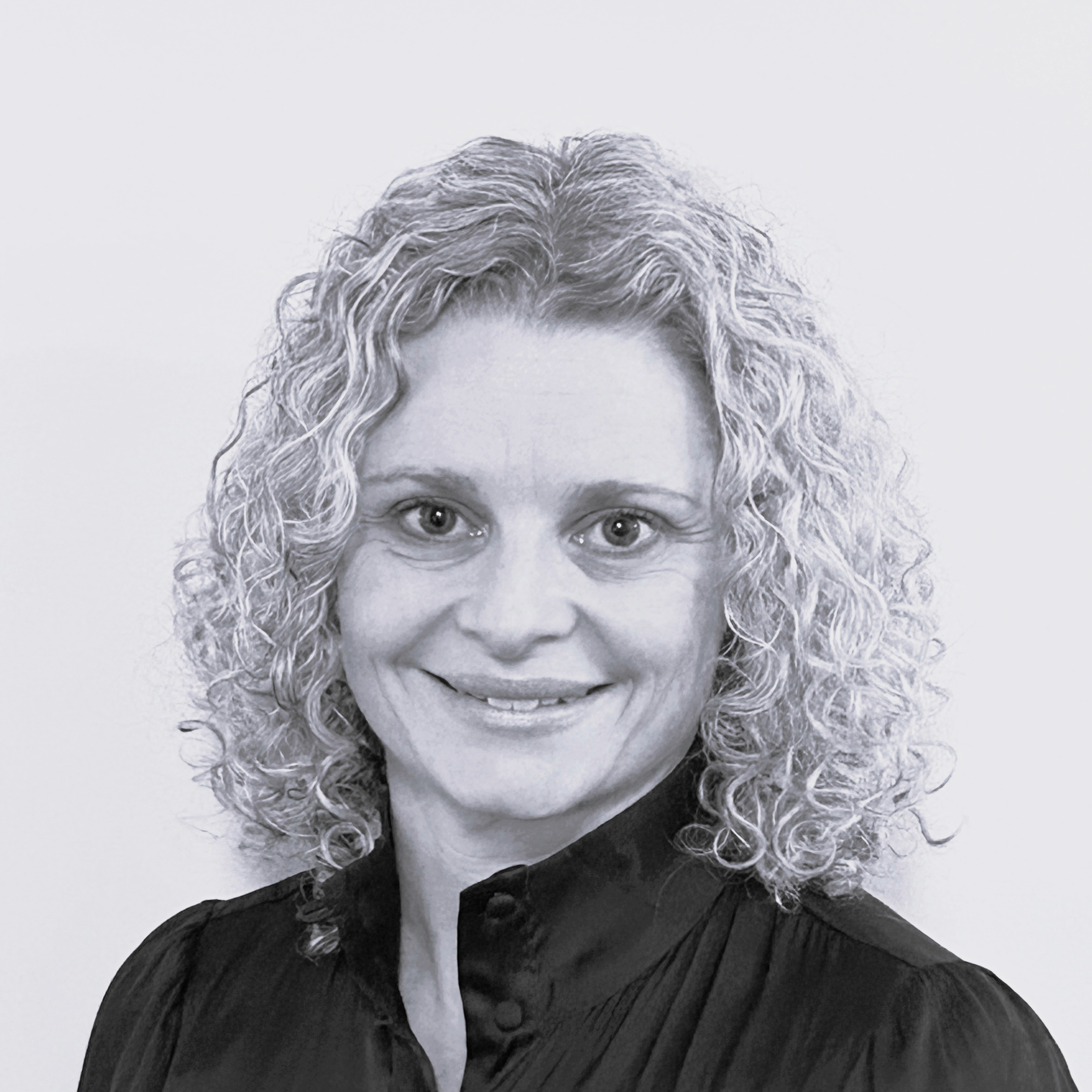 Portrait of Life First GP Dr Sally Blombery, smiling at the camera.