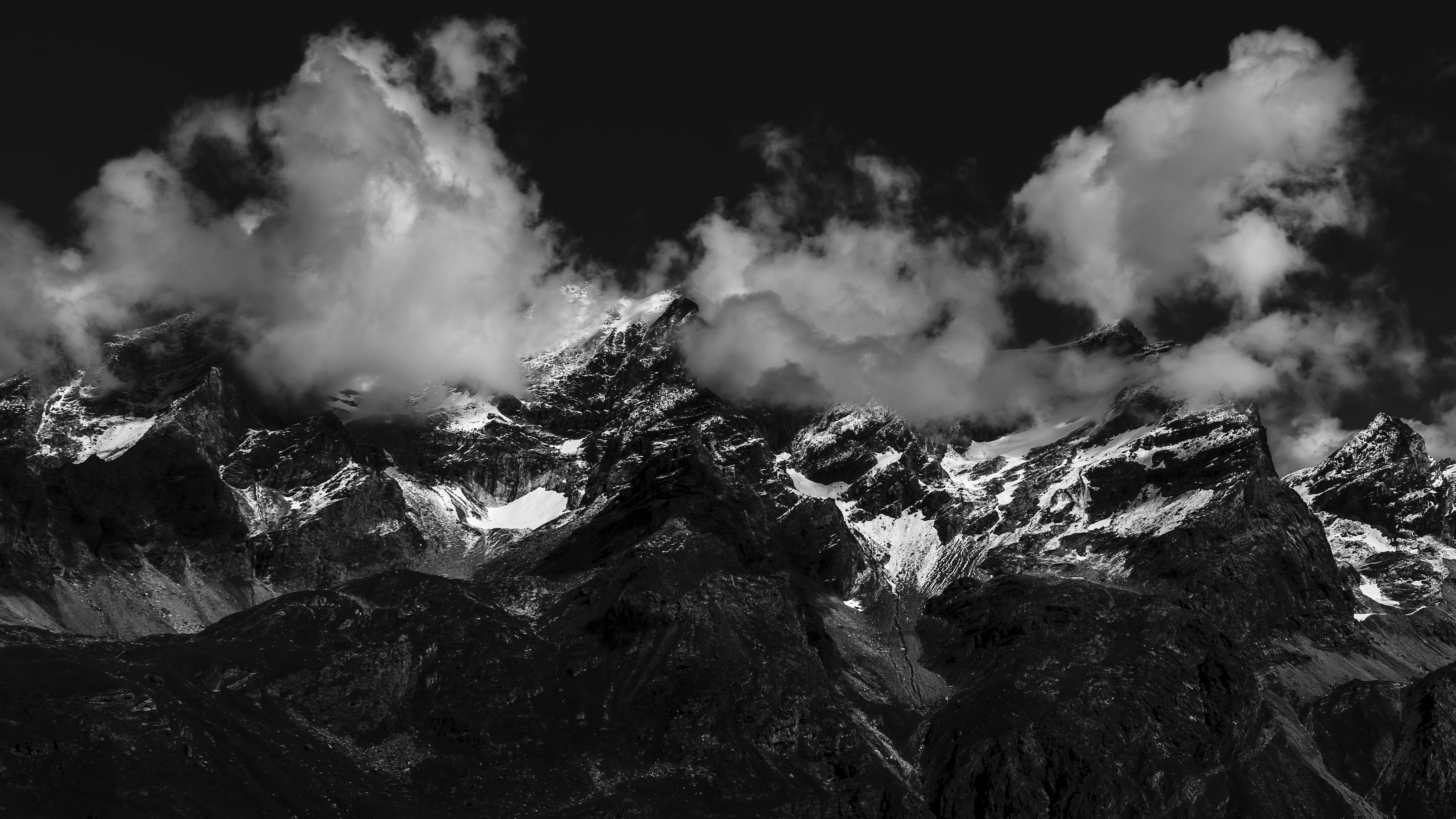 grayscale photo of mountain covered by snow