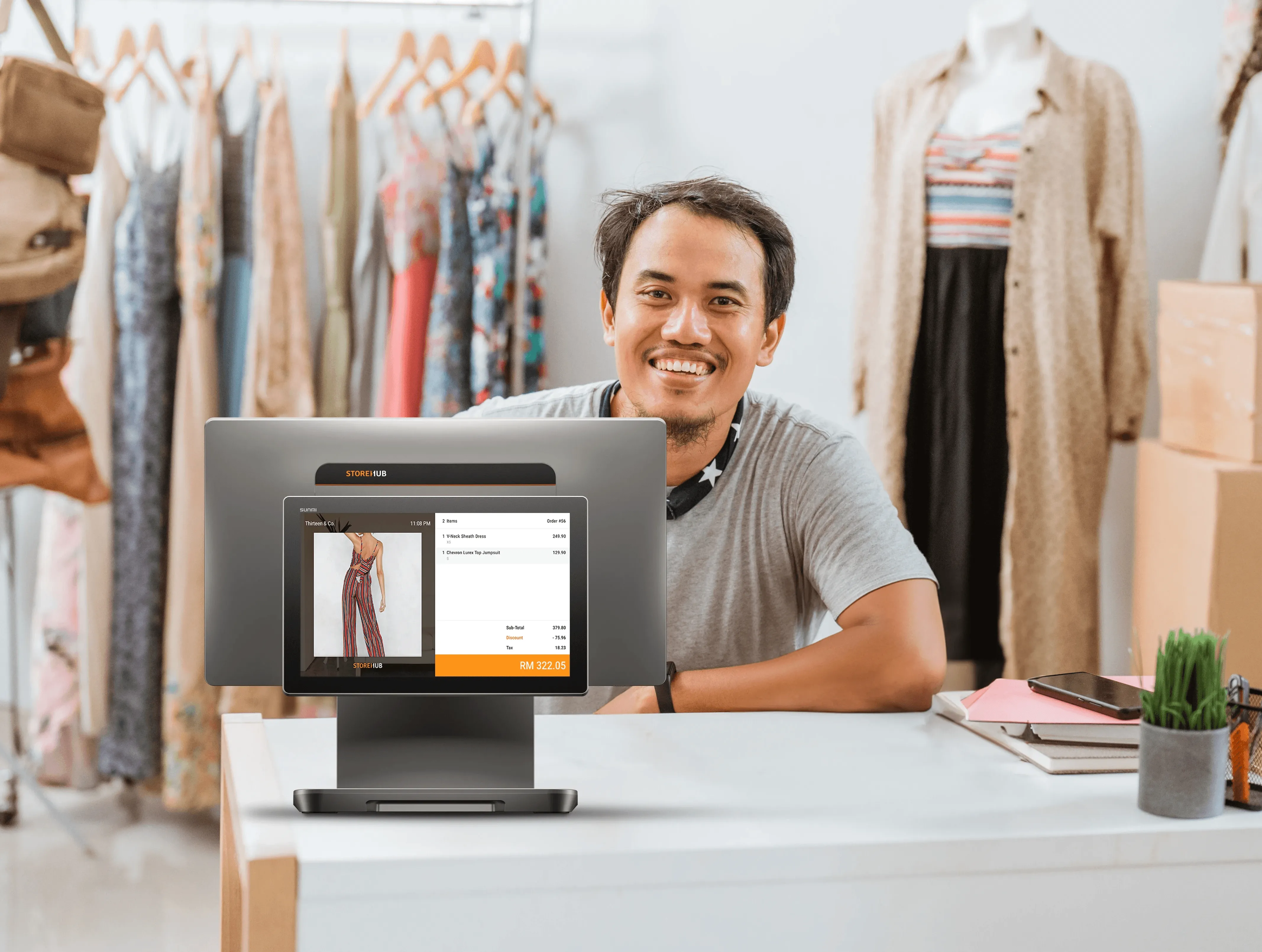 Malaysian retail business owner using the StoreHub cloud POS system for inventory management and sales reporting.