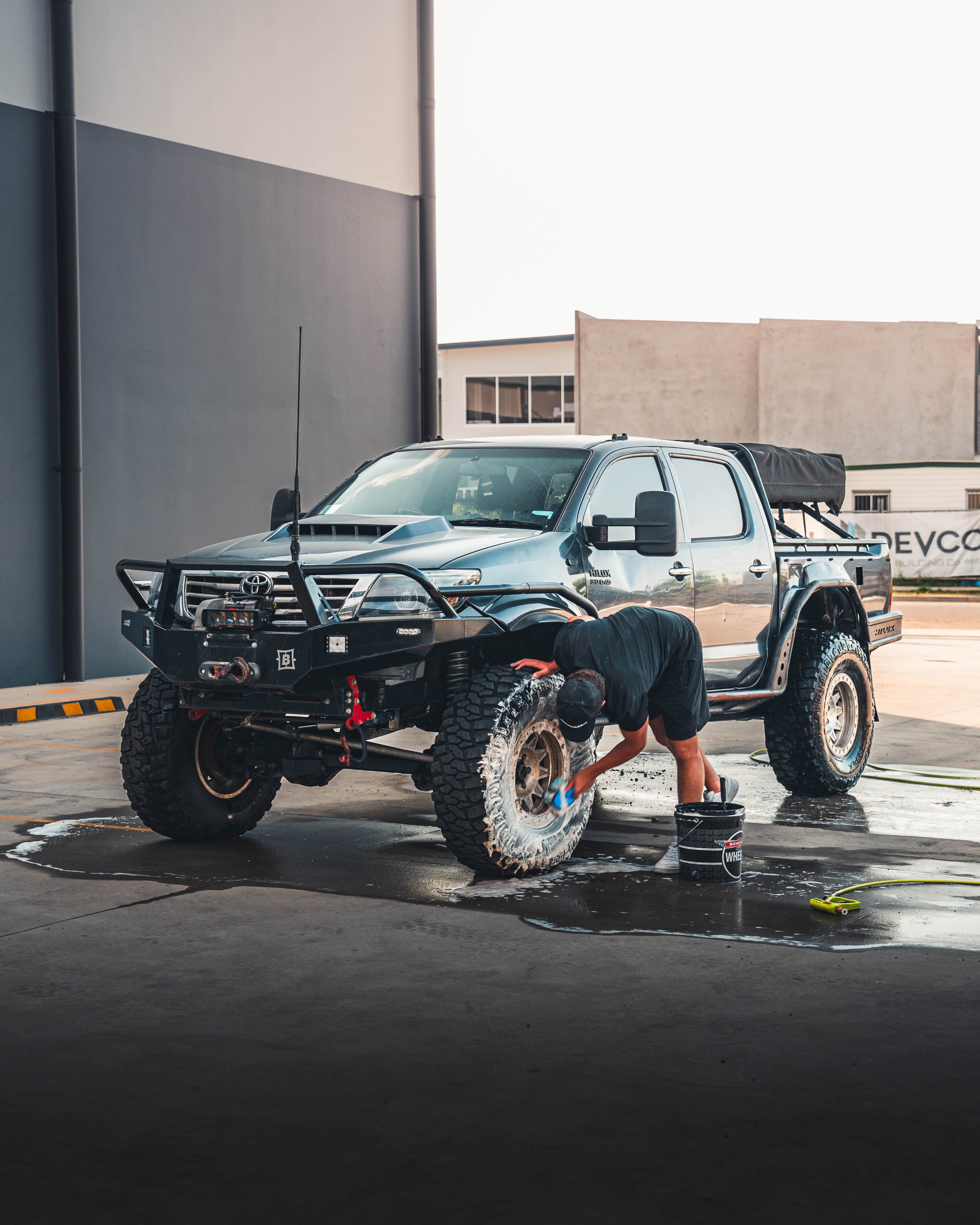 Professional image of a Toyota Hilux being detailed, captured to showcase service-based brand content in action.