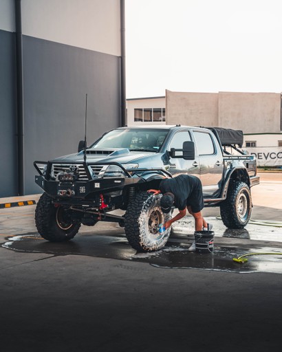 Professional image of a Toyota Hilux being detailed, captured to showcase service-based brand content in action.
