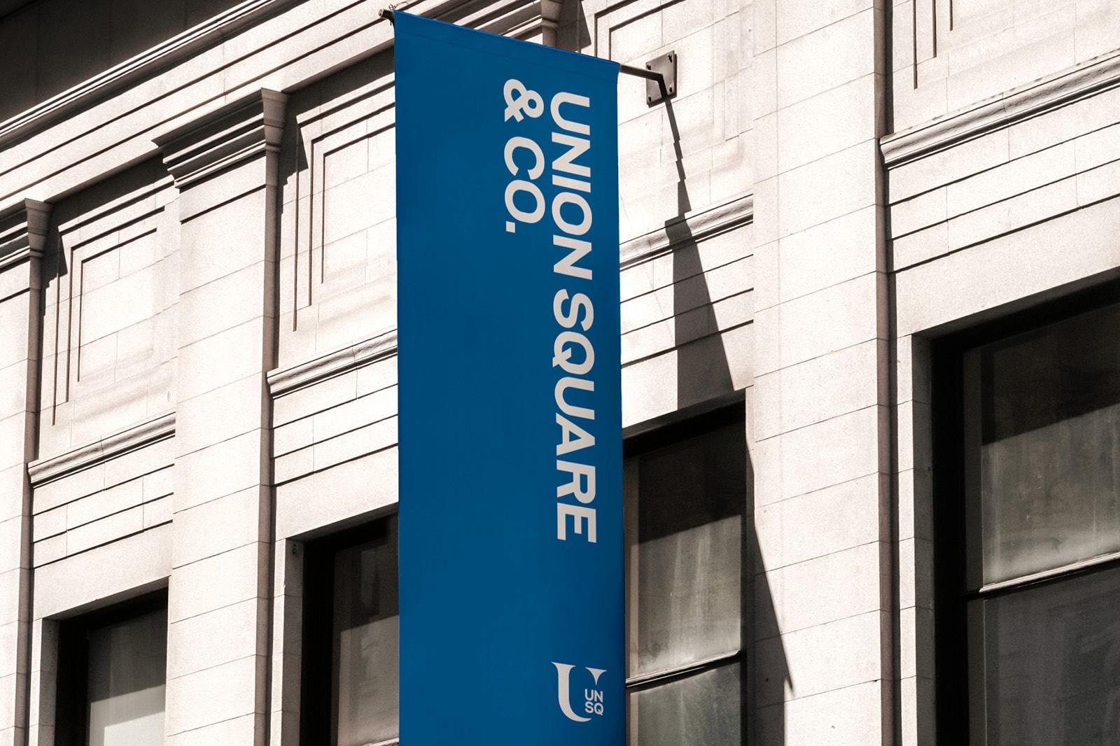 Signage on a building featuring a banner denoting Union Square & Co.