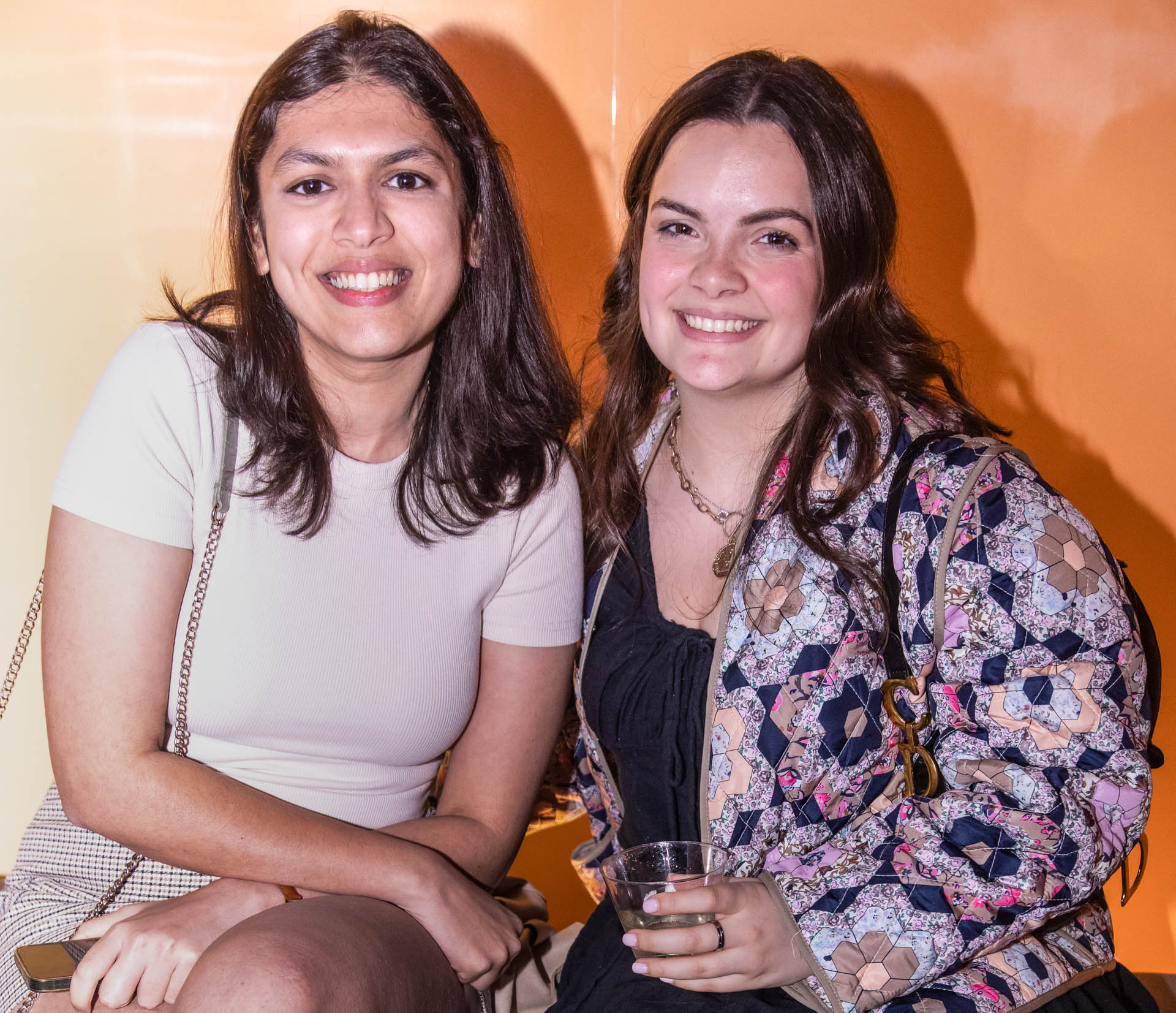 a group of students smiling for the camera in the SVA Theatre lobby after the Venture Forum