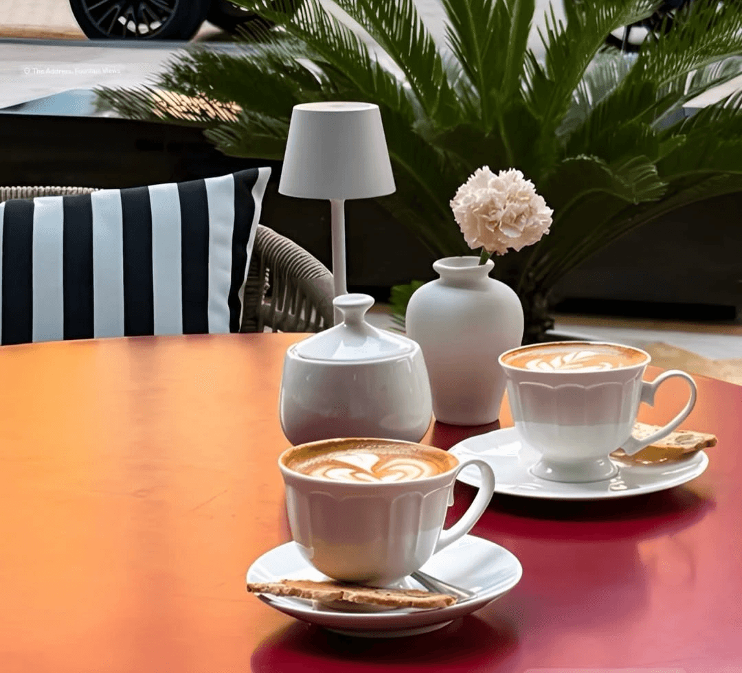 Top view of two specialty coffees beside the menu.