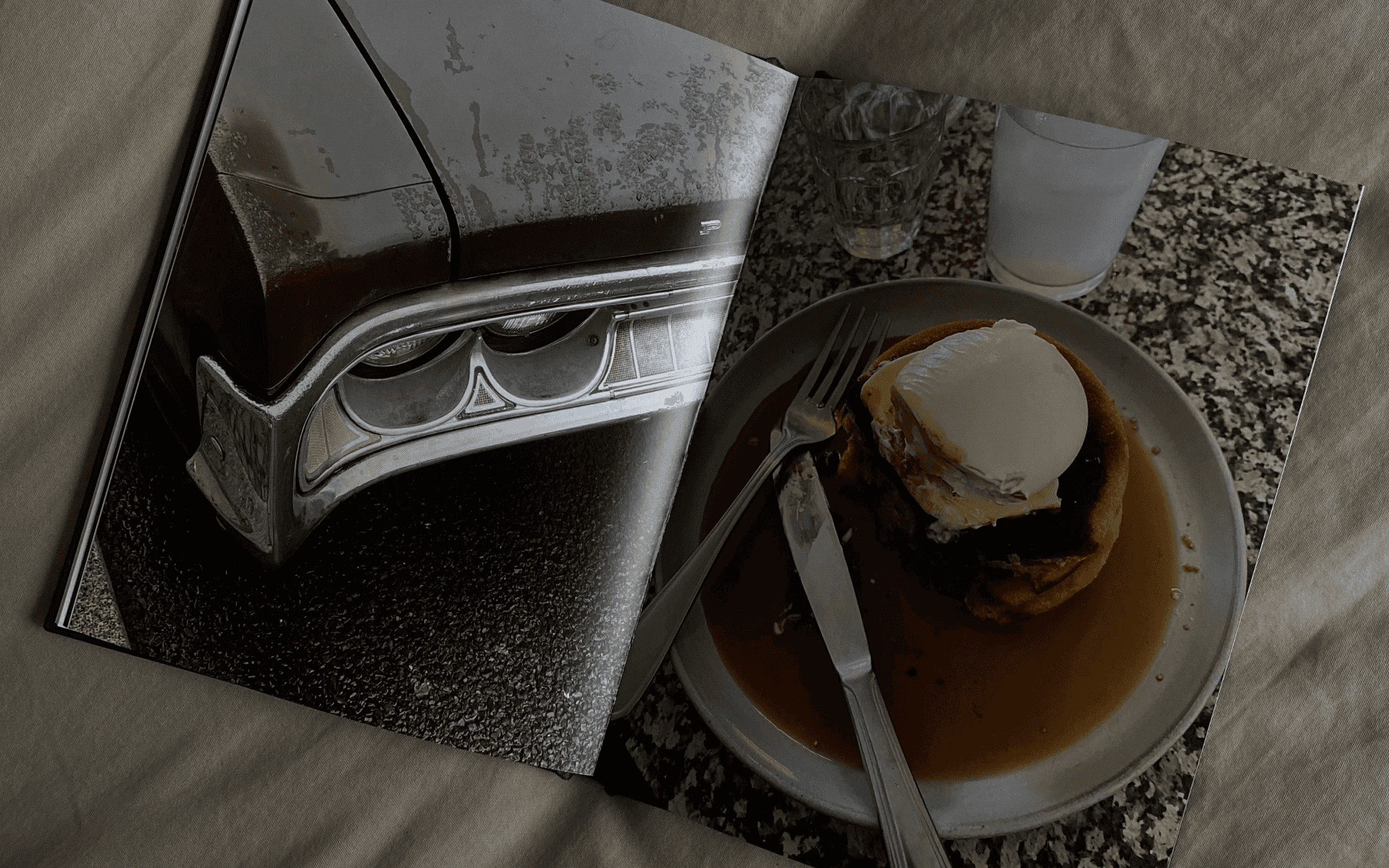 Coffee table book / Photo book of Berlin showing half eaten pancakes and the trunk of an old car.
